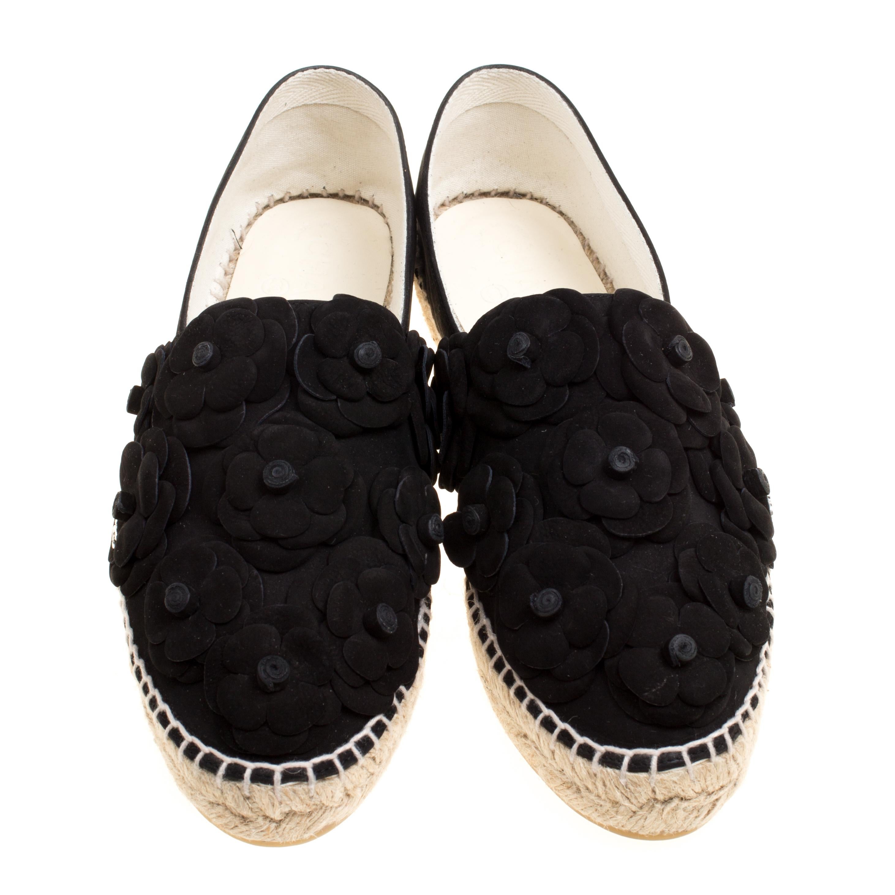 Espadrilles are not just stylish, but also comfortable and easy to wear. This lovely pair from Chanel's 2017 Cruise Collection will accompany a casual outfit with perfection. They are made of suede and detailed with Camellia appliques on the