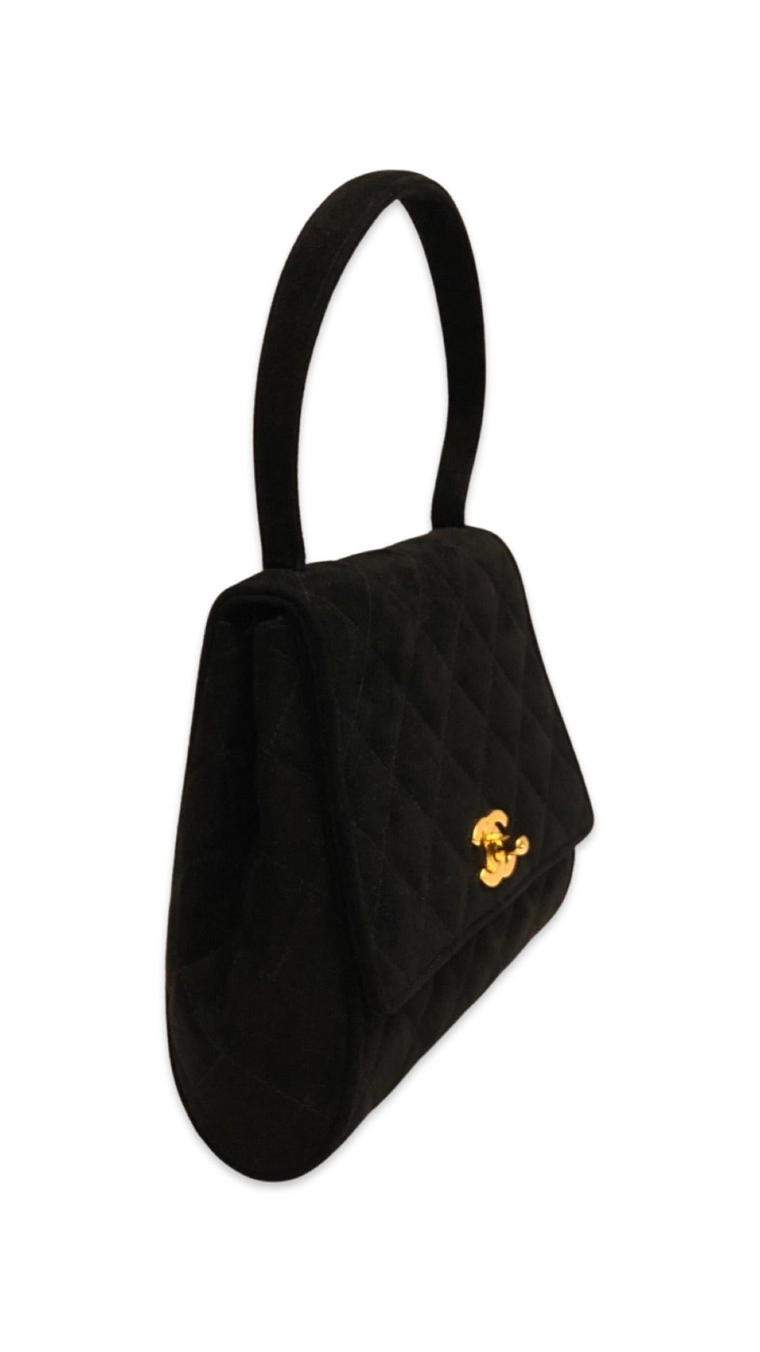- Vintage Chanel black suede CC turn-lock flap handbag.

- Circa 1994-1996.

- One Interior pocket zip closure. One slip pocket. 

- 20cm x 17cm x 6cm. Handle drop: 14cm. 



