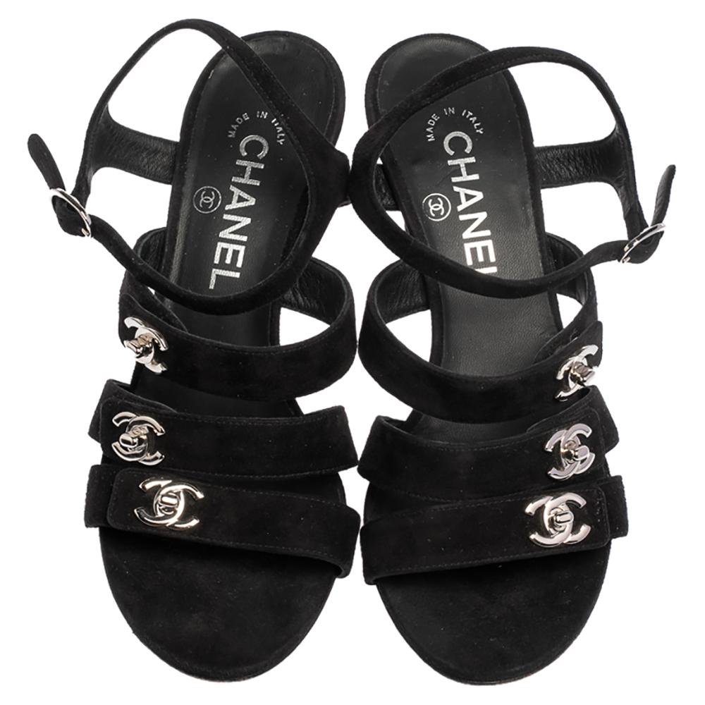 These stylish sandals by Chenal will add a touch of sophistication to every ensemble. They have been crafted from suede and come in a lovely shade of black. They have open toes, CC turn-lock detailing on the straps, ankle strap and 7 cm