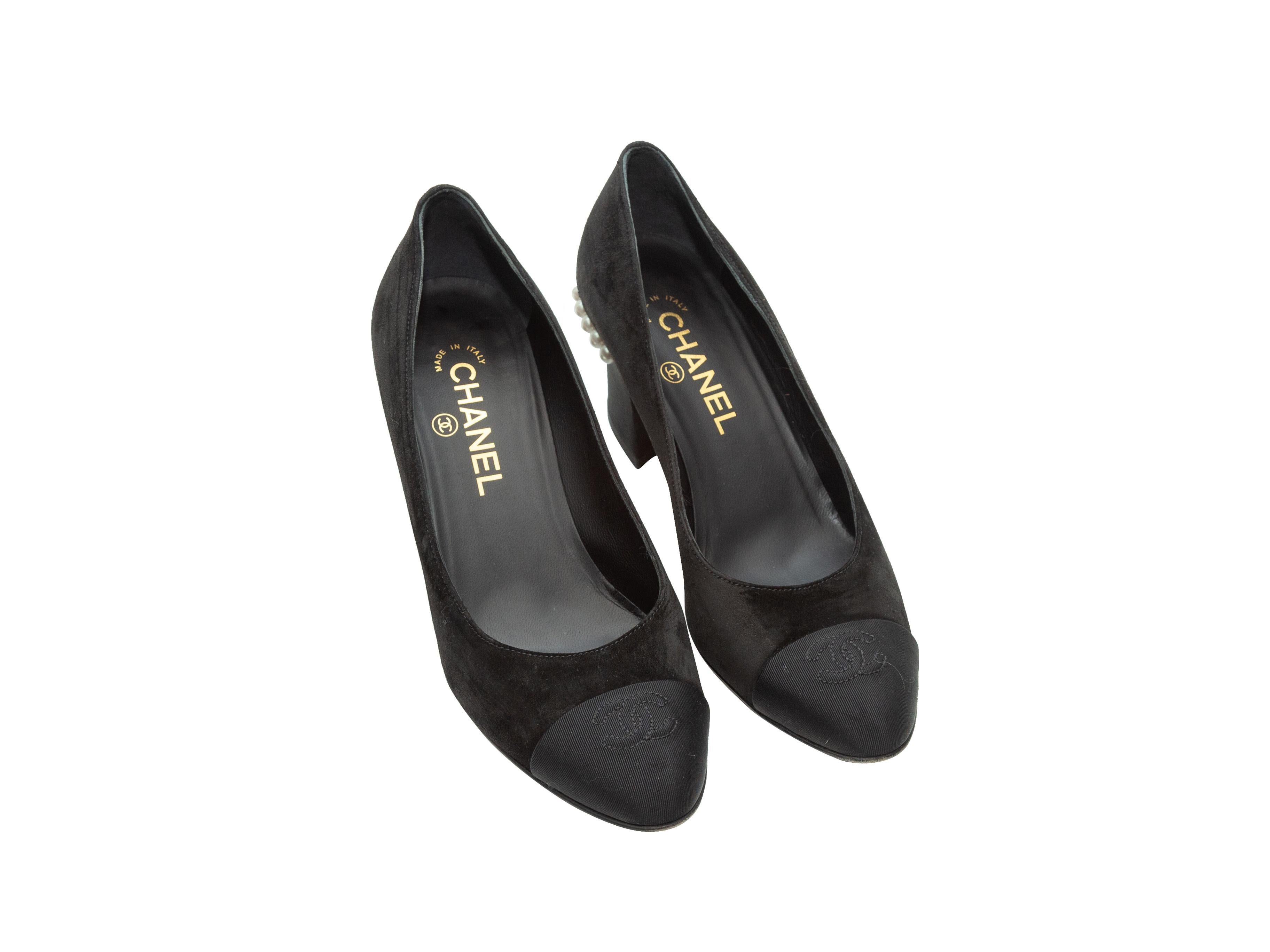 Product details: Black suede round-toe heels by Chanel. Faux pearl accents at covered block heels. Designer size 37. 2.5