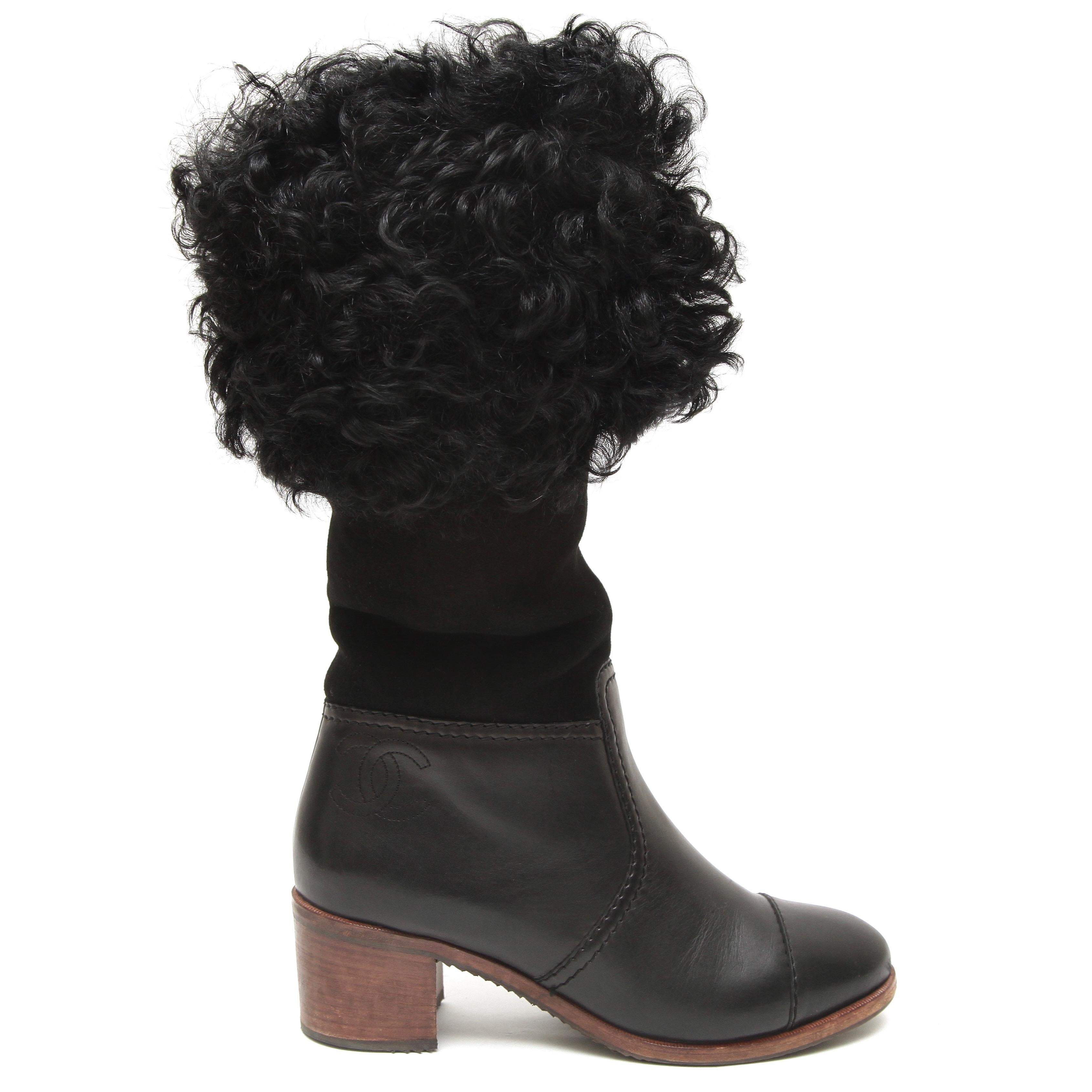 GUARANTEED AUTHENTIC CHANEL 2015 15B BLACK MID-CALF BOOTS

Retailed excluding sales taxes $1,825.

Details:
- Black suede and leather uppers.
- Sheep fur around top of boot.
- Rounded cap toe.
- CC logo at side of boot.
- Block  heels.
- Pull-on.
-