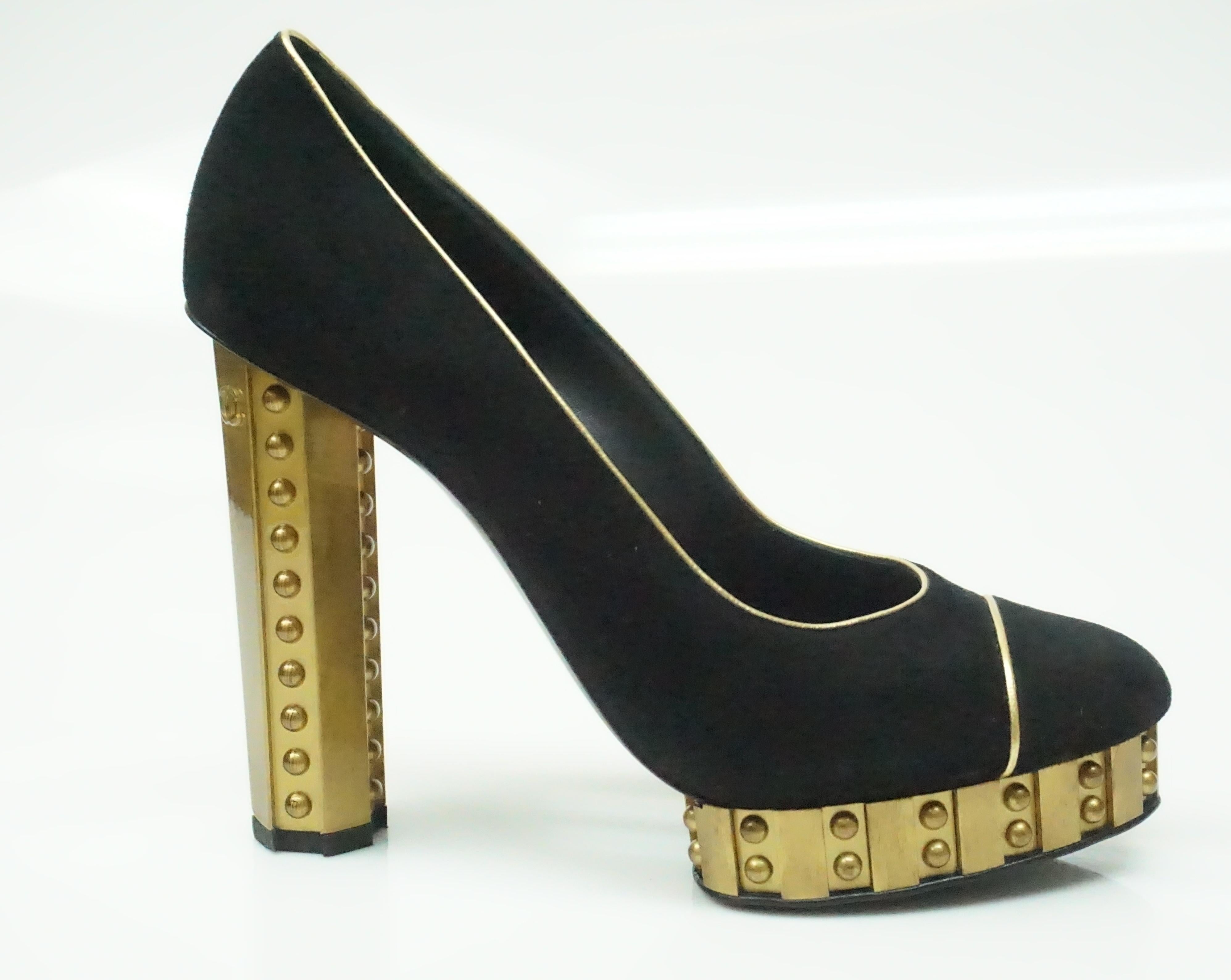 CHANEL Black Suede Pump with Gold Hammered Heel - 38. These amazing shoes are in excellent condition, with barely any sign of use. They are black suede and the heel is composed of thick gold metal with tiny button appliques. The shoe sits on a