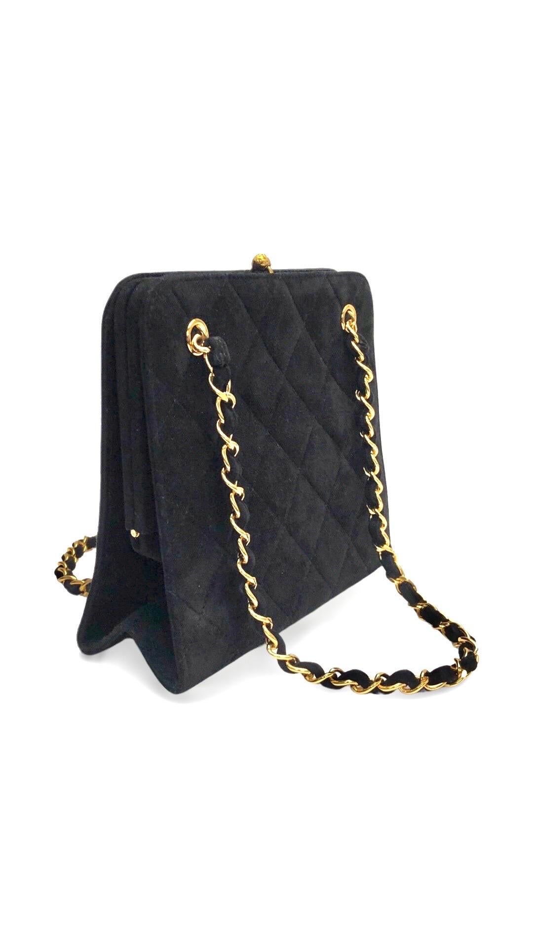 - Chanel black suede quilted gold toned chain handbag from year 1996 to 1997 collection. 

- Featuring a gold toned 