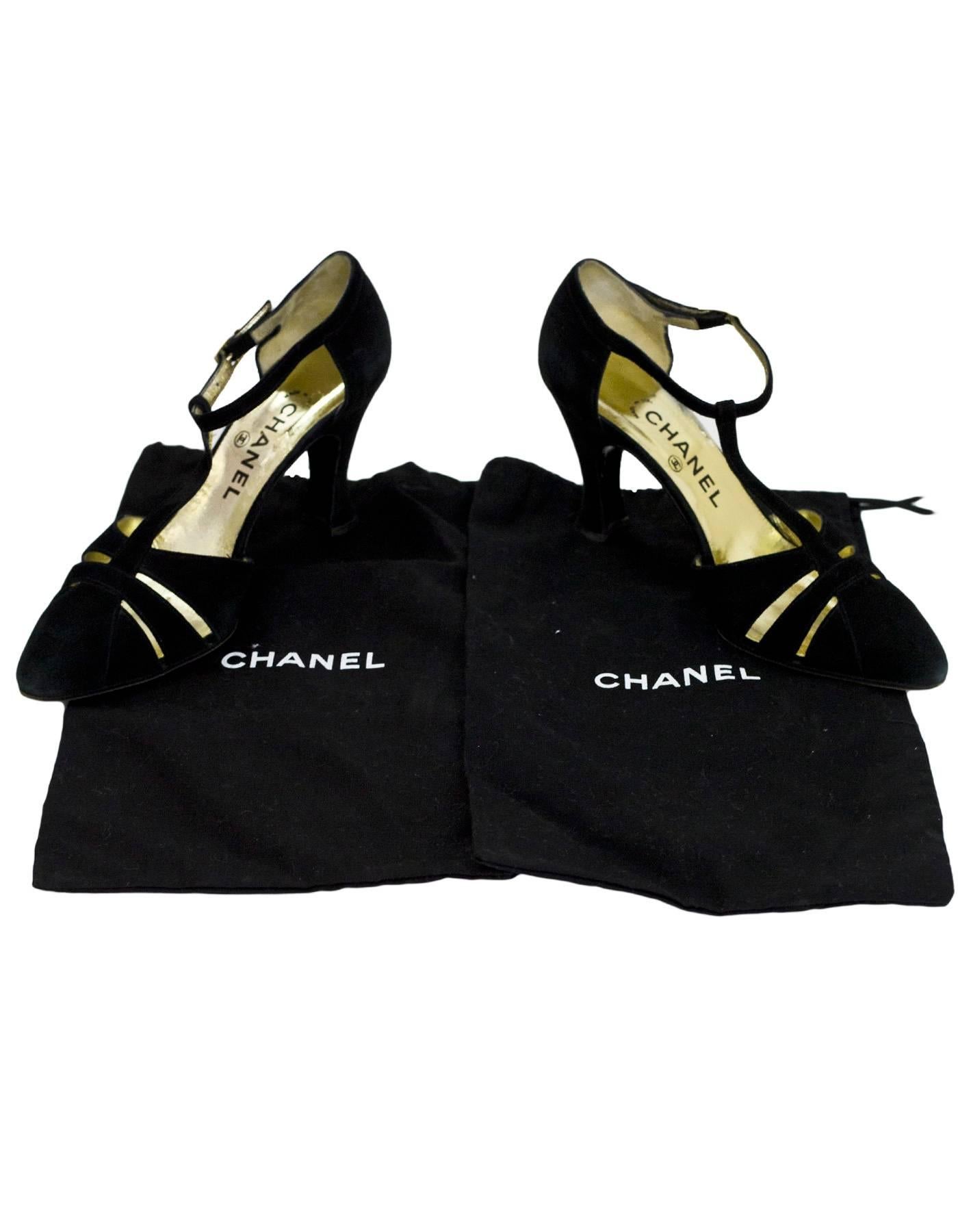 Chanel Black Suede T-Strap Pumps Sz 37.5

Made In: Italy
Color: Black
Materials: Suede
Closure/Opening: Ankle strap with buckle closure
Sole Stamp: CC Made in Italy 37.5
Overall Condition: Excellent pre-owned condition with the exception of some