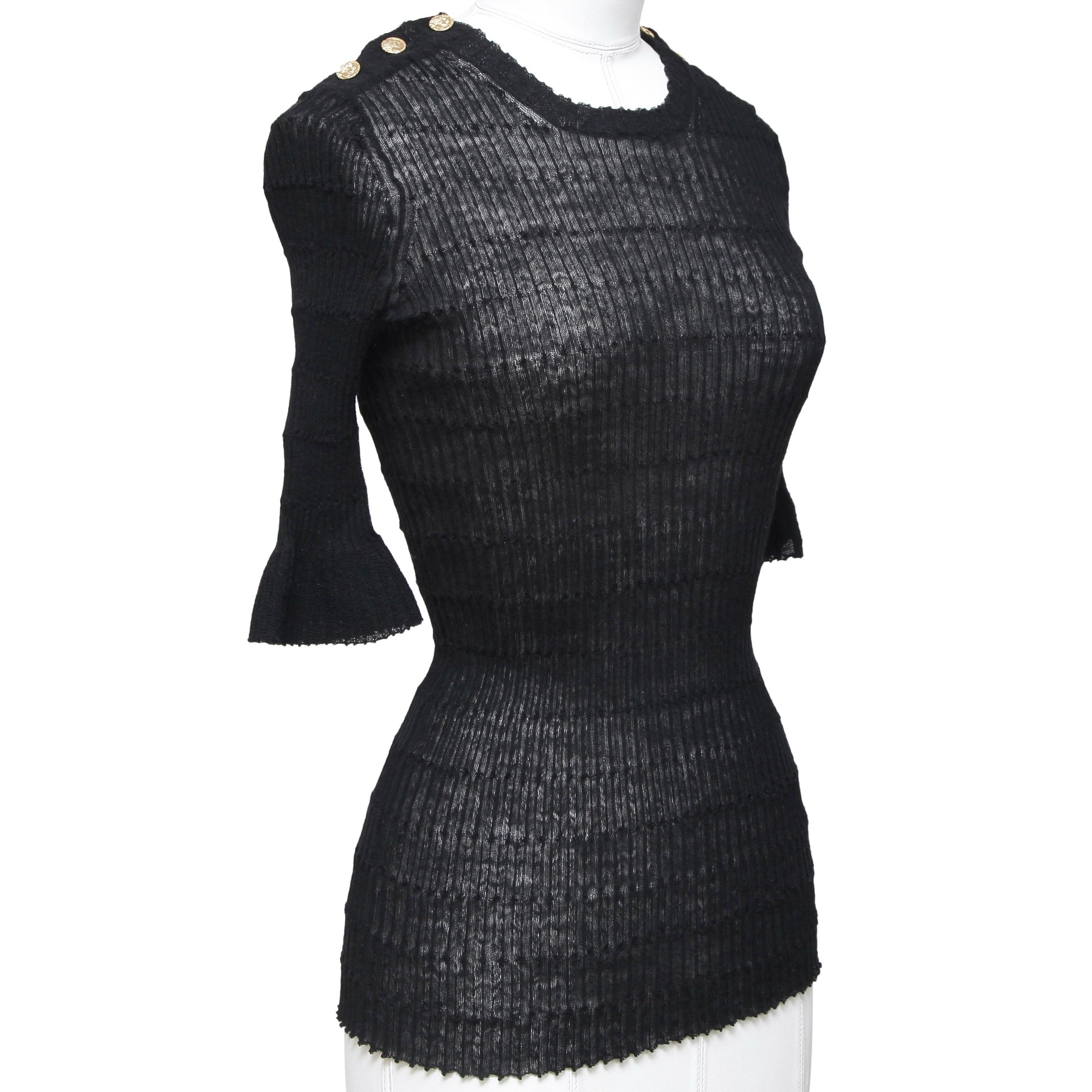 GUARANTEED AUTHENTIC CHANEL 2016 ROME COLLECTION BLACK SEMI-SHEER KNIT

Design:
- Ever-so lightly semi-sheer knit top from the 2016 Rome Collection.
- Crew neck.
- Collection themed buttons on each shoulder.
- Slip on.

Size: 34

Measurements