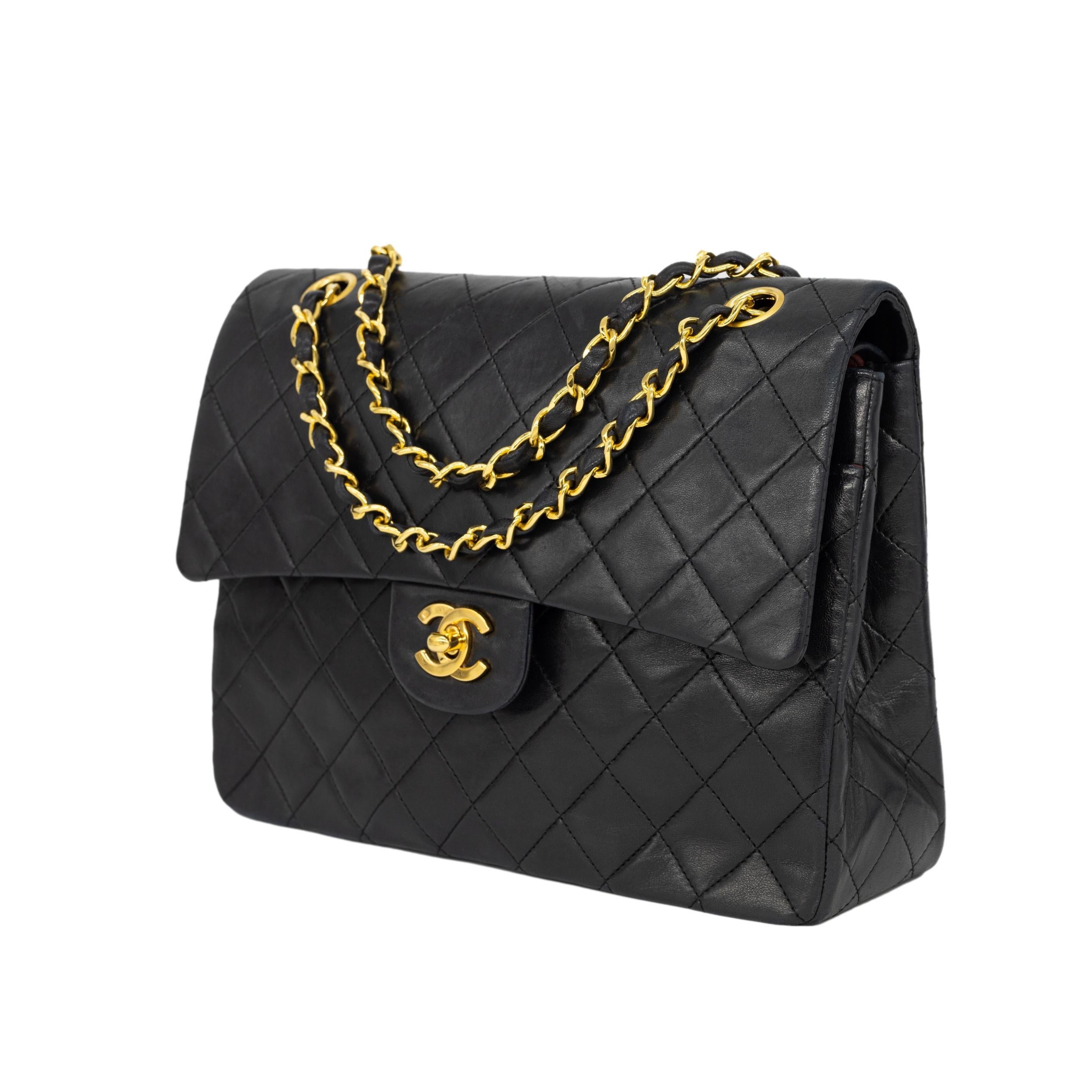 Chanel Black Tall Lambskin Double Flap Mademoiselle Chain Shoulder Bag, 1989 - 1991. The iconic Chanel bag was originally issued by Coco Chanel in February 1955 which became the very first socially acceptable shoulder bag for the modern day woman of