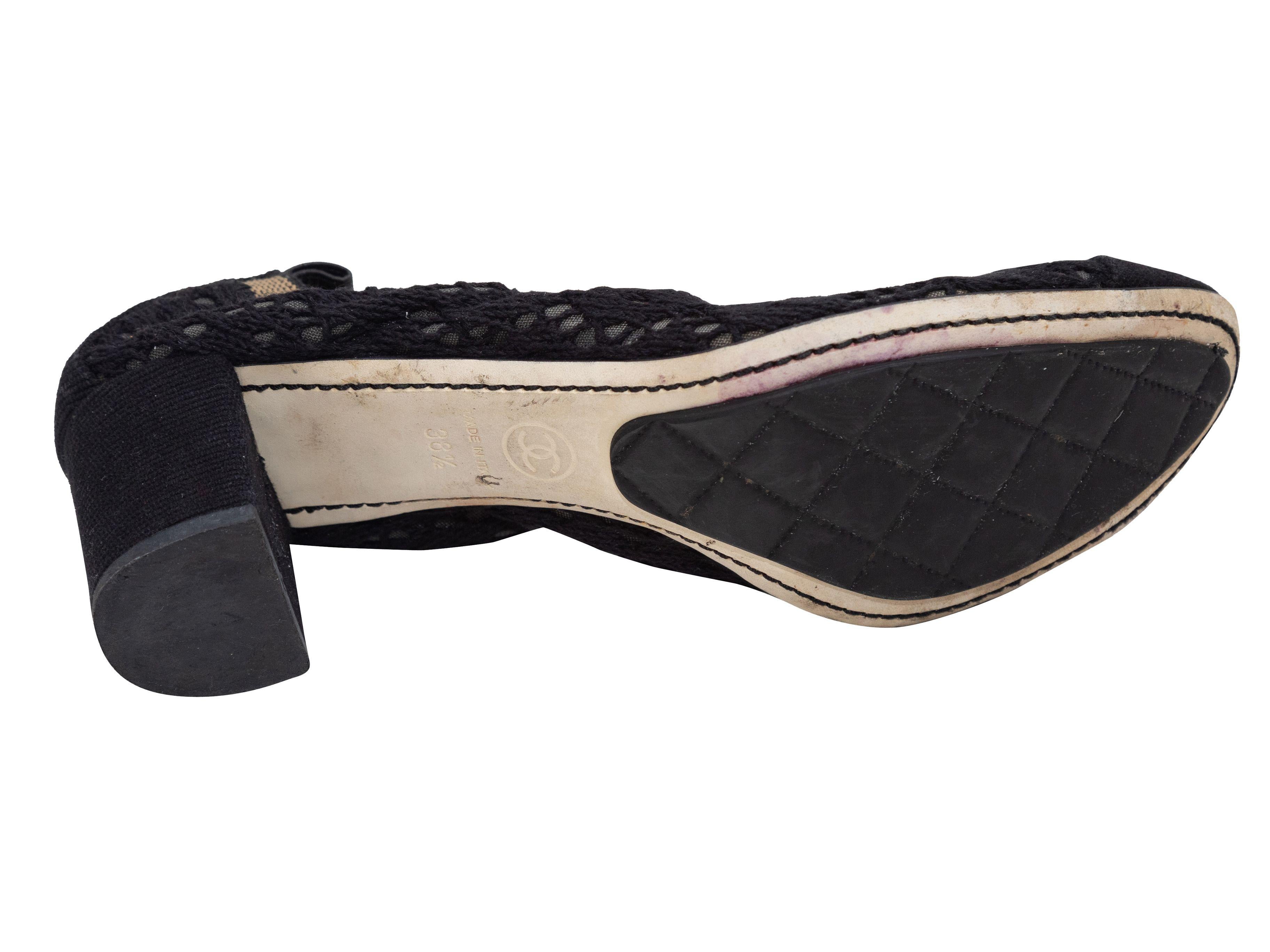Product Details: Black and tan knit cap-toe heels by Chanel. Block heels. 0.5