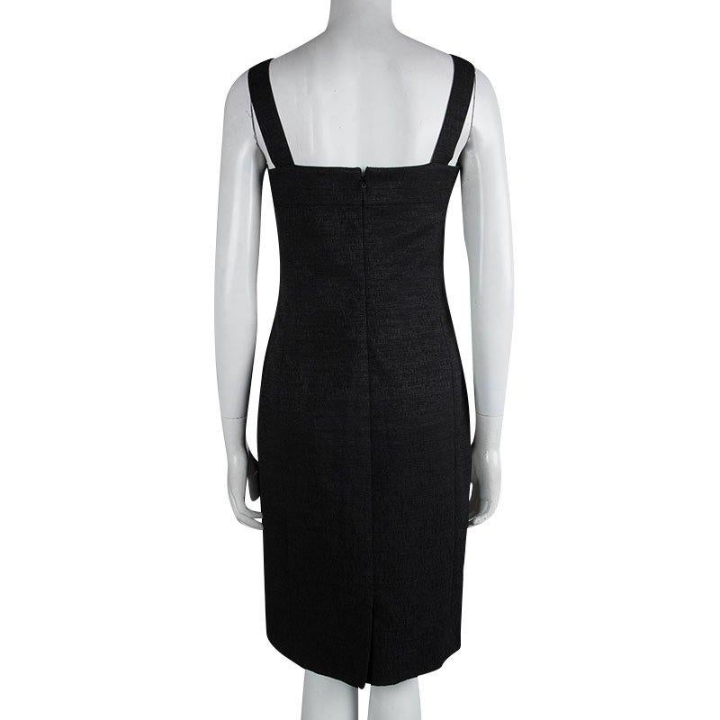 The dresses created by Chanel are backed by advanced tailoring technology paired with high precision cuts. Crafted from the blend of polyester and cotton, this black sleeveless dress created in France looks chic has double lining with silk and