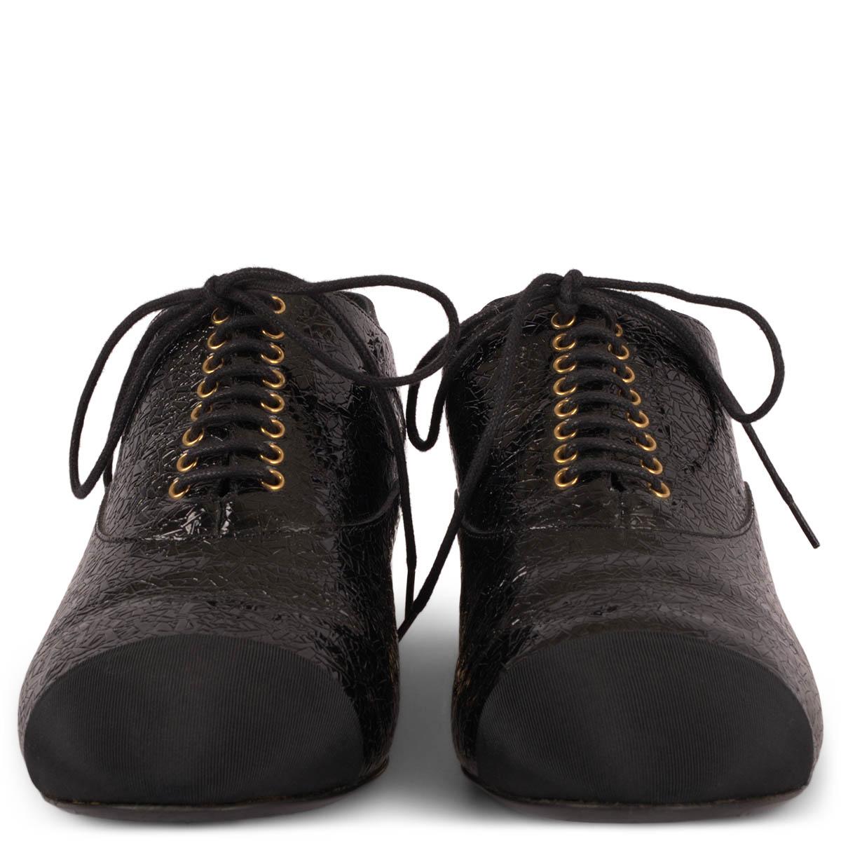 100% authentic Chanel lace-up oxford flats in black textured patent leather with grosgrain cap toe. Features gold-tone eyelets and heel trim with faux pearl. Have been worn and are in excellent condition. Come with dust bag.

2017 Paris-Cuba