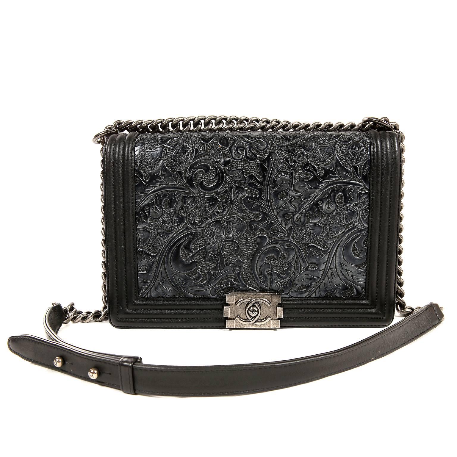Chanel Black Tooled Leather Paris Dallas Cordoba Boy Bag- Pristine Condition; appears never carried.
 A rare style from the 2014 collection, the updated Boy Bag receives special treatment with a tooled leather façade and ruthenium hardware