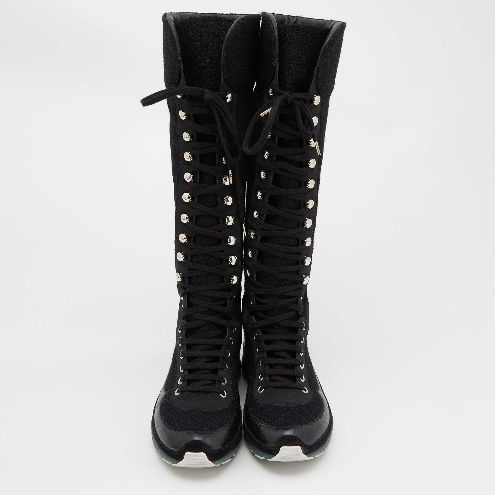 These boots from Chanel will last you for many seasons as they are made from a mix of quality materials and designed with fashion in mind. They come in black with round toes, laces along the front, and sneaker-like rubber soles.

