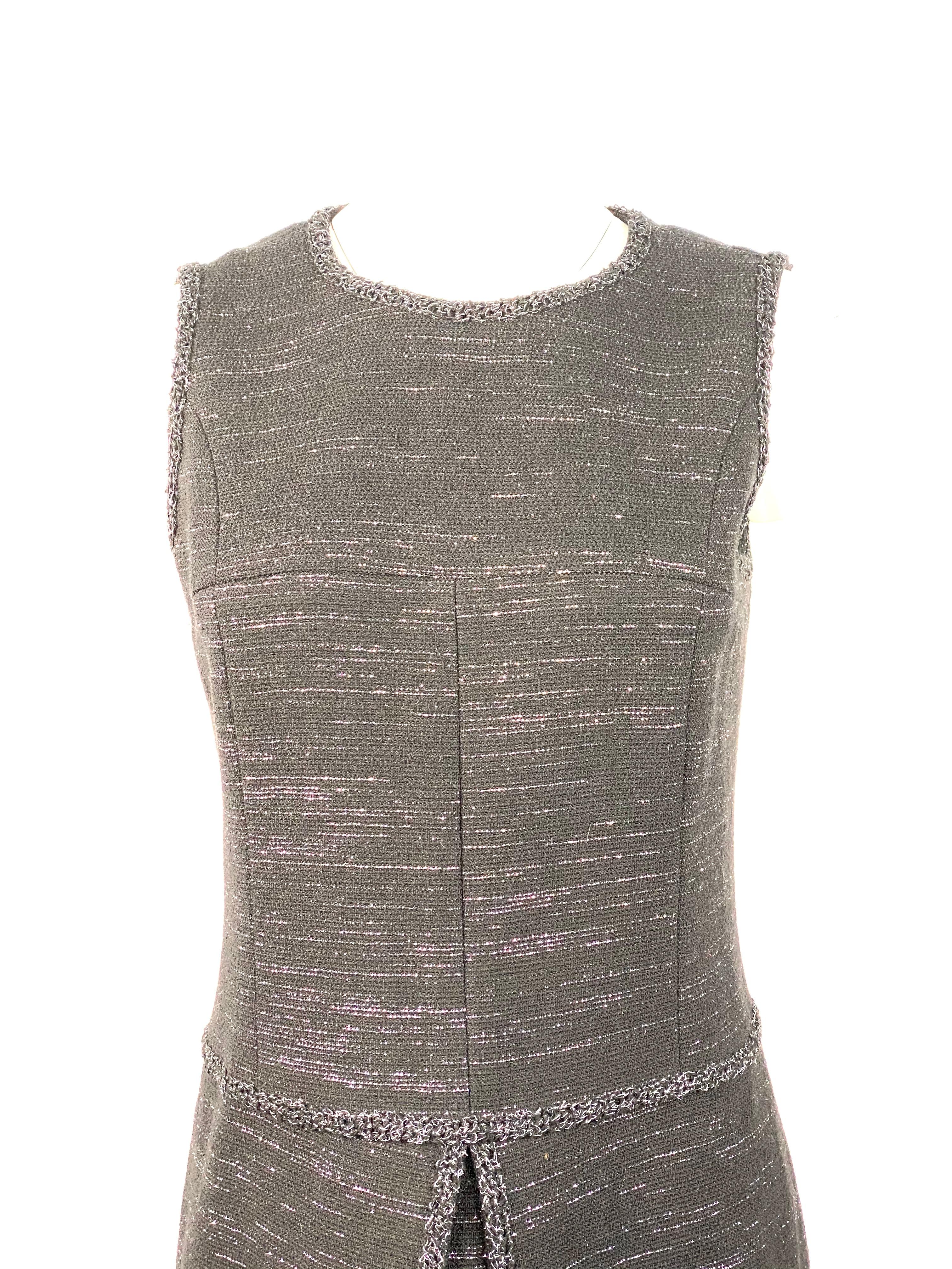Chanel Black Tweed and Metallic Sleeveless Midi Dress Size 40

Product details:
Size 40
Black tweed with metallic detail
92% Wool
Featuring front slit design detail
Rear zip and hook closure 
Double silk lining with Chanel logo pattern
Made in