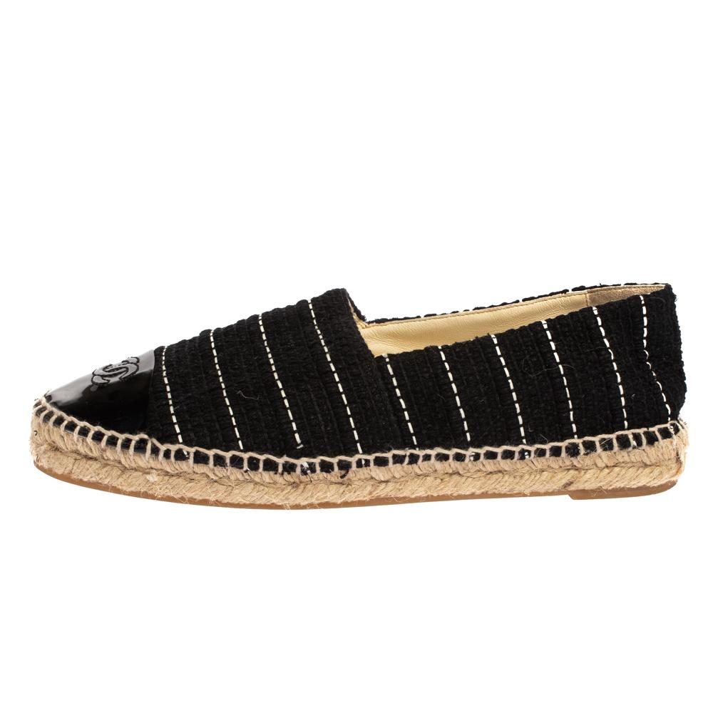 Espadrilles are not just stylish, but also comfortable and easy to wear. This lovely pair from Chanel will accompany a casual outfit with perfection. They are made of black tweed and designed with patent leather cap toes carrying the CC logo and