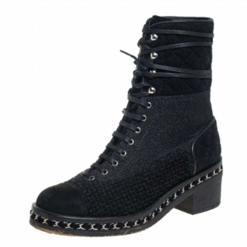 Chanel creations are a sight to behold, for they are tailor-made to deliver sophistication, style and quality in spades. These combat boots are no different. They have been crafted from tween and suede and carry a classic shade of black. They are