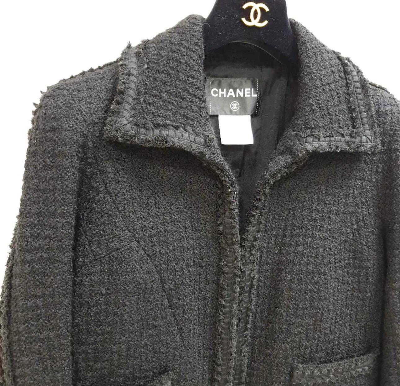 Chanel classic wool little black jacket.
Can be worn as opened front or closing with hook and eyes
Lightly padded shoulder
Two small pockets
Hook and eye closure
100% wool; 
Camellia print lining in 86% silk, 14% spandex
Sz.42 Runs smaller Fits for