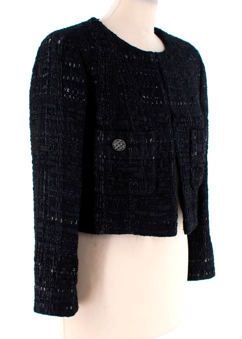  Chanel Black Tweed Cropped Jacket

- Fully lined
- Two front pocket closed with a logo embellished tonal button
- Button finished cuffs
- Metallic thread details
- Cropped design
- Hook closure at the front

Materials:
47% Nylon
19% Cotton
12%