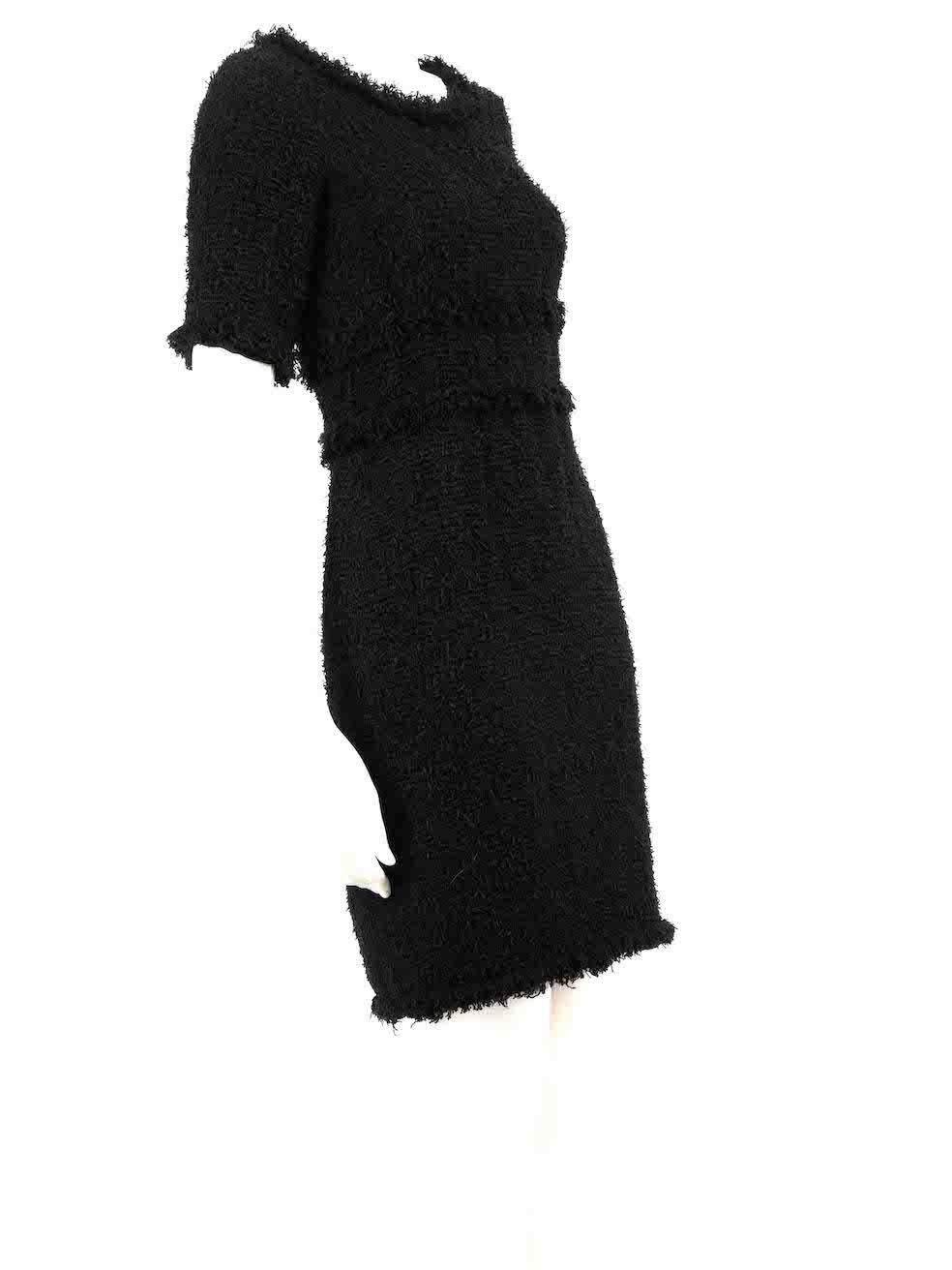 CONDITION is Very good. Minimal wear to dress is evident. Minimal wear to the neckline and underarm linings with light marks on this used Chanel designer resale item.
 
 
 
 Details
 
 
 Black 
 
 Tweed
 
 Dress
 
 Short sleeves
 
 Knee length
 
