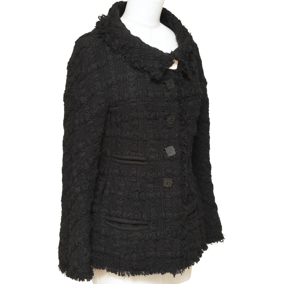 GUARANTEED AUTHENTIC CHANEL 2011A BLACK TWEED JACKET

Matching skirt is available for sale in a separate listing.

Design:
- Acrylic wool blend black tweed jacket from the 2011A collection.
- Peter pan collar.
- Dual slip pockets.
- Black button