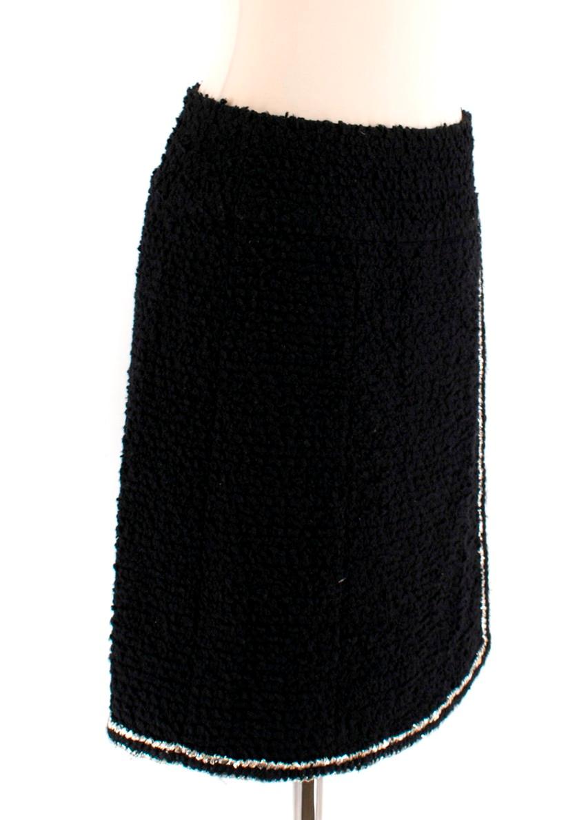 Chanel Black Tweed Wrap Skirt 

- Black high waist wrap skirt
- Thick waist band 
- Metallic silver stitching around the edges
- Zip up back fastening

Materials
- Outer: 70% Wool, 18% Nylon, 12% Silk
- Inner lining: 100% Silk

Made in