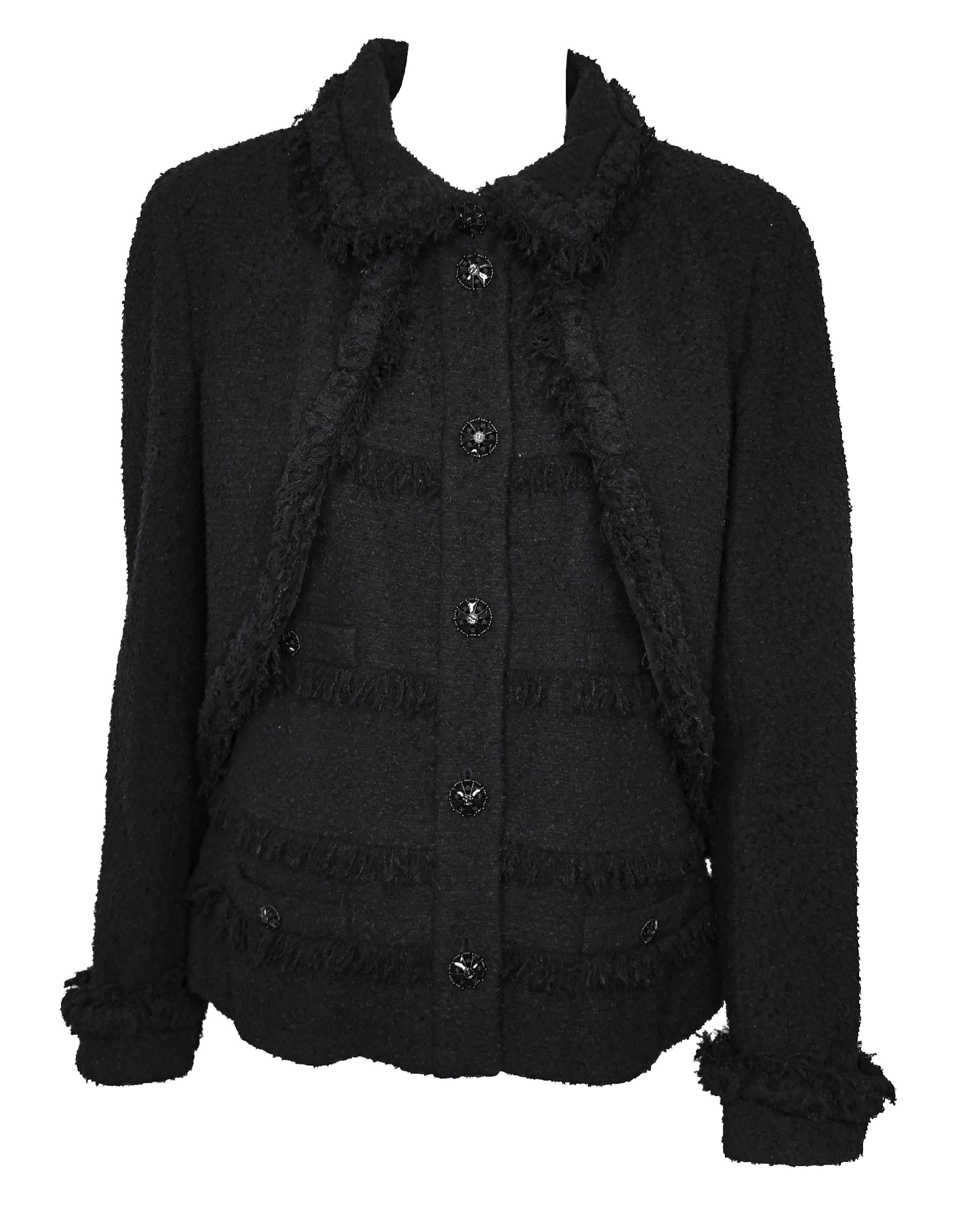 Chanel black tweed sleeveless top with attached bolero jacket overlay was in the 2008 runway collection.  This unusual jacket is a vest style top with a bolero jacket overlay.  This long sleeve jacket has up turn cuffs and 4 faux pockets with Chanel