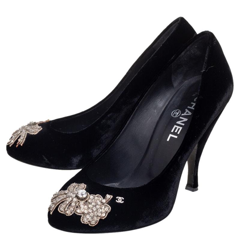 There are some shoes that stand the test of time and fashion cycles, these timeless Chanel pumps are the one. Crafted from velvet in a black shade, they are designed with sleek cuts, round-toes accented with opulent crystals, and tall heels.

