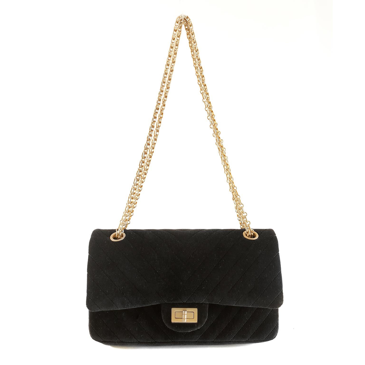 Chanel Black Velvet Chevron Reissue Bag-  pristine condition
Rich textures combined with matte gold hardware accents make this a collectible standout piece.  
Luxurious black velvet is quilted in chevron pattern.  Matte gold mademoiselle twist lock