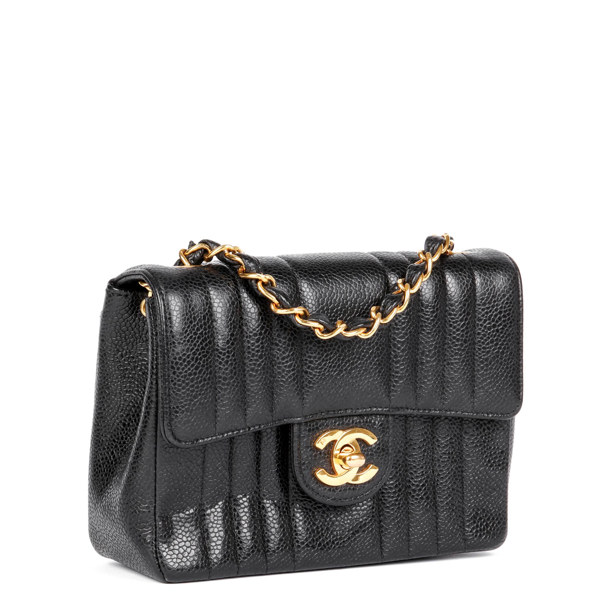 CHANEL
Black Vertical Quilted Caviar Leather Vintage Square Mini Flap Bag

Xupes Reference: HB4874
Serial Number: 24253376
Age (Circa): 1992
Accompanied By: Chanel Dust Bag
Authenticity Details: Serial Sticker (Made in France)
Gender: Ladies
Type: