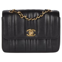 CHANEL Black Vertical Quilted Lambskin Vintage Mini Flap Bag