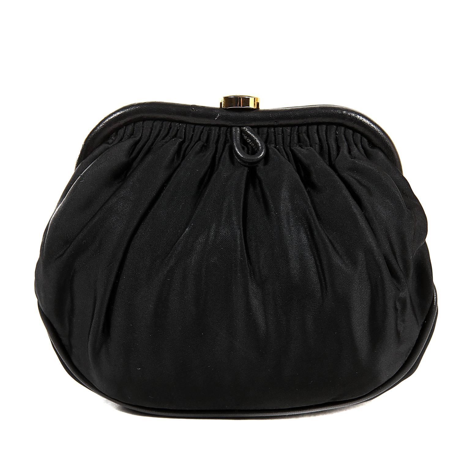 Chanel Black Vintage Evening Bag- Excellent Condition
The classic framed style and extra- long strap make it an easy choice for any occasion.
Black fabric framed bag has feminine pleating and black leather piping.  A gold CC coin acts as a kiss lock