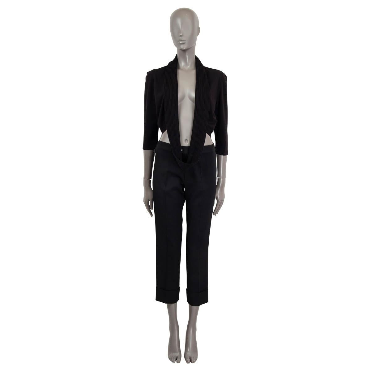 100% authentic Chanel 3/4 sleeve cropped bolero jacket in black viscose (100%) features an attached rib shawl around the waist or can be worn around the neck. Has been worn and is in excellent condition. 

Measurements
Model	Chanel06C P27610
Tag
