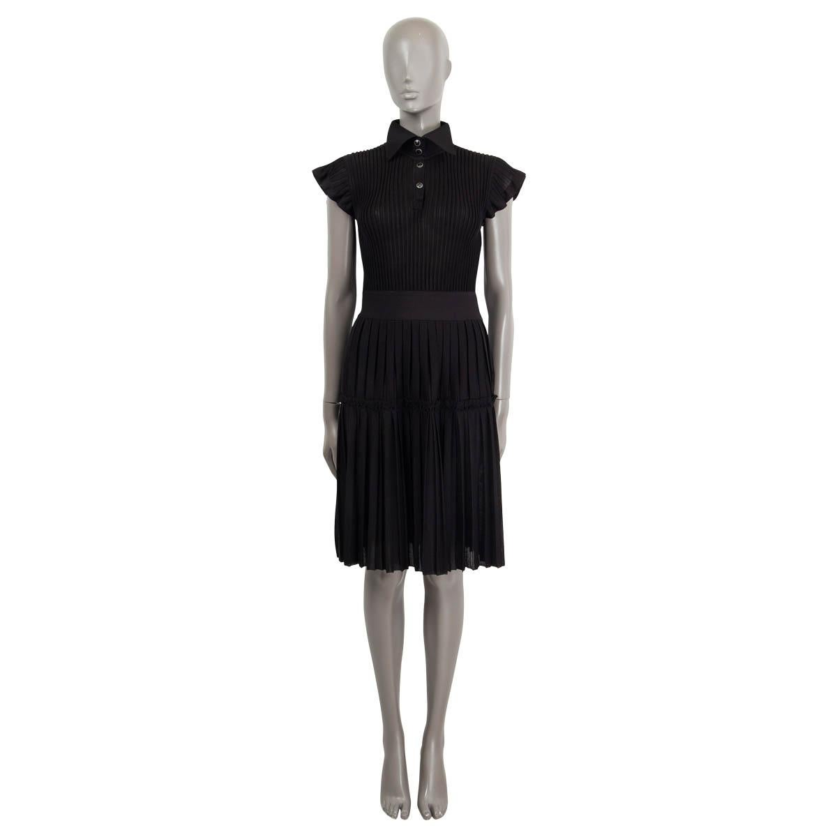 100% authentic Chanel 2018 Pre-Fall rib-knit dress in black viscose (76%) and silk (24% - please note content tag is missing) with a wingtip collar and 4 CC logo silver-tone front buttons. Dress has a ribbed top part and pleated skirt part with a