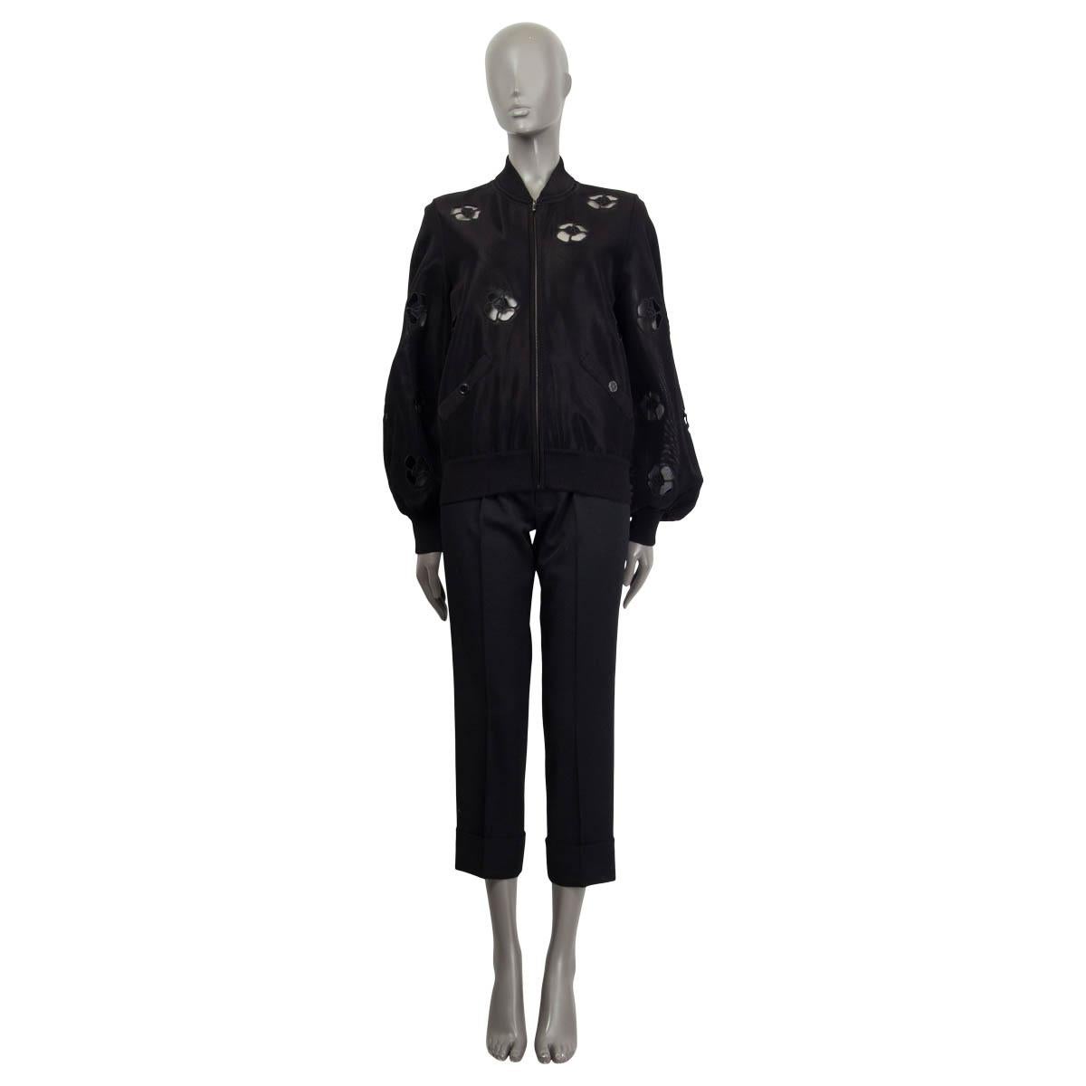 100% authentic Chanel 2018 Camellia Cut Out Blouson Bomber Jacket in black slightly sheer viscose (93%) and polyamide (7%). Has two buttoned pockets at front. Unlined. Has been worn once or twice and is in excellent condition. 

Measurements

Tag