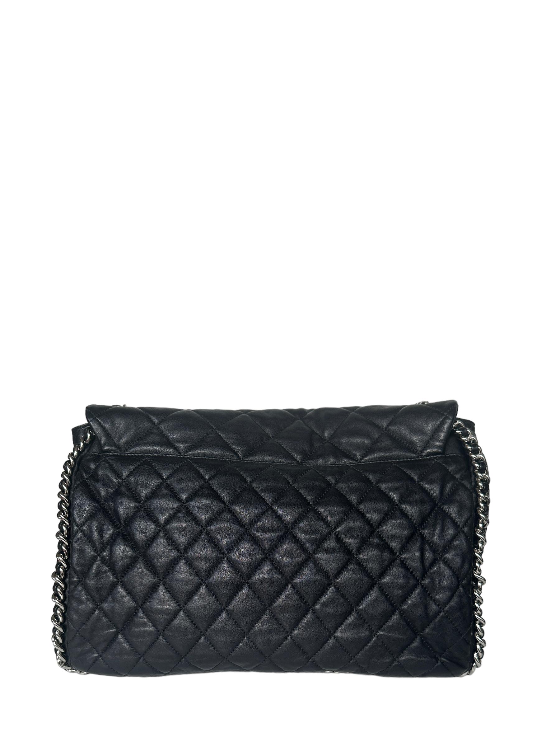 Chanel Black Washed Lambskin Quilted Maxi Chain Around Flap Bag

Made In: Italy
Year of Production: 2011
Color: Black
Hardware: Silvertone
Materials: Washed lambskin leather
Lining: Beige textile
Closure/Opening: Flap top with magnet
Exterior