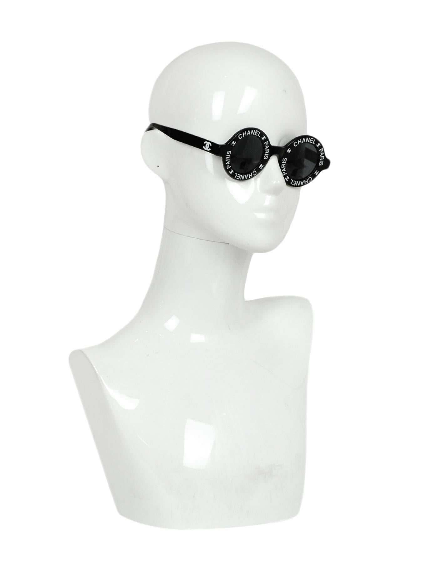 Chanel Black/White 1993 Vintage Runway Round CHANEL PARIS Sunglasses

Made In: Italy
Year of Production: 1993
Color: Black and white
Materials: Acetate 
Overall Condition: Excellent pre-owned condition
Includes: Chanel case and box


Measurements: