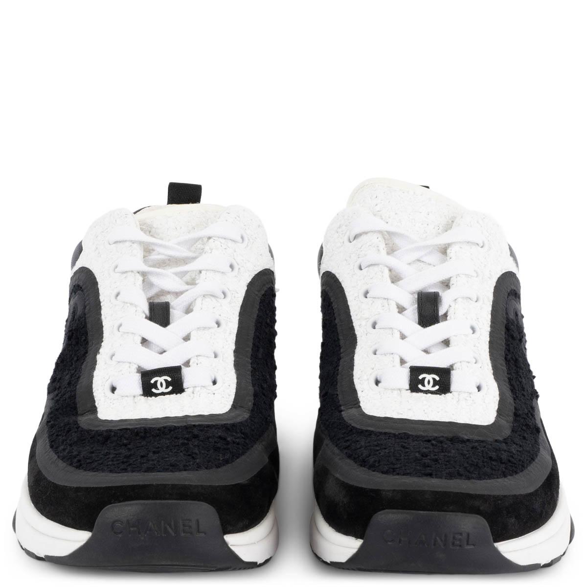 100% authentic Chanel 2021 CC low-top sneakers in black & white bouclé set on a black & white rubber sole with a black padded leather detail on the heel. Have been worn and are in excellent condition. 

Measurements
Model	Chanel21S G34360
Imprinted