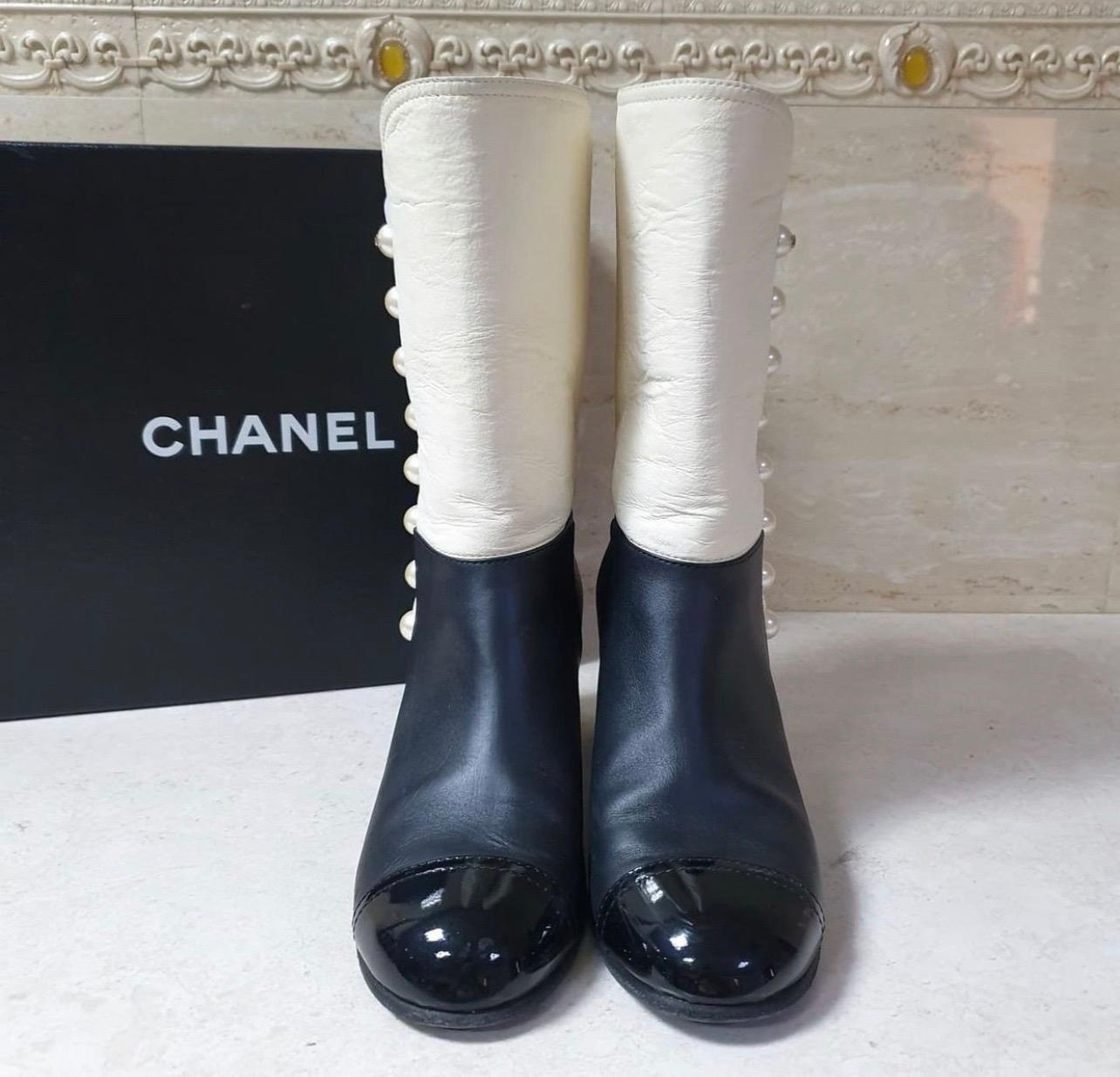 white and black chanel boots