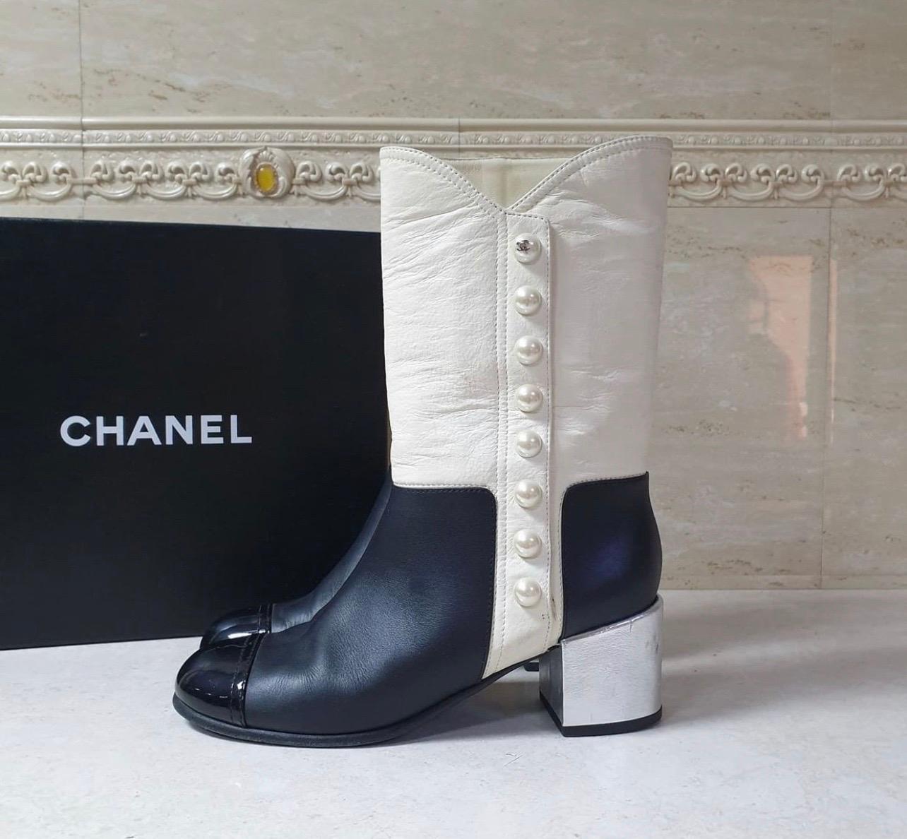 black and white chanel boots