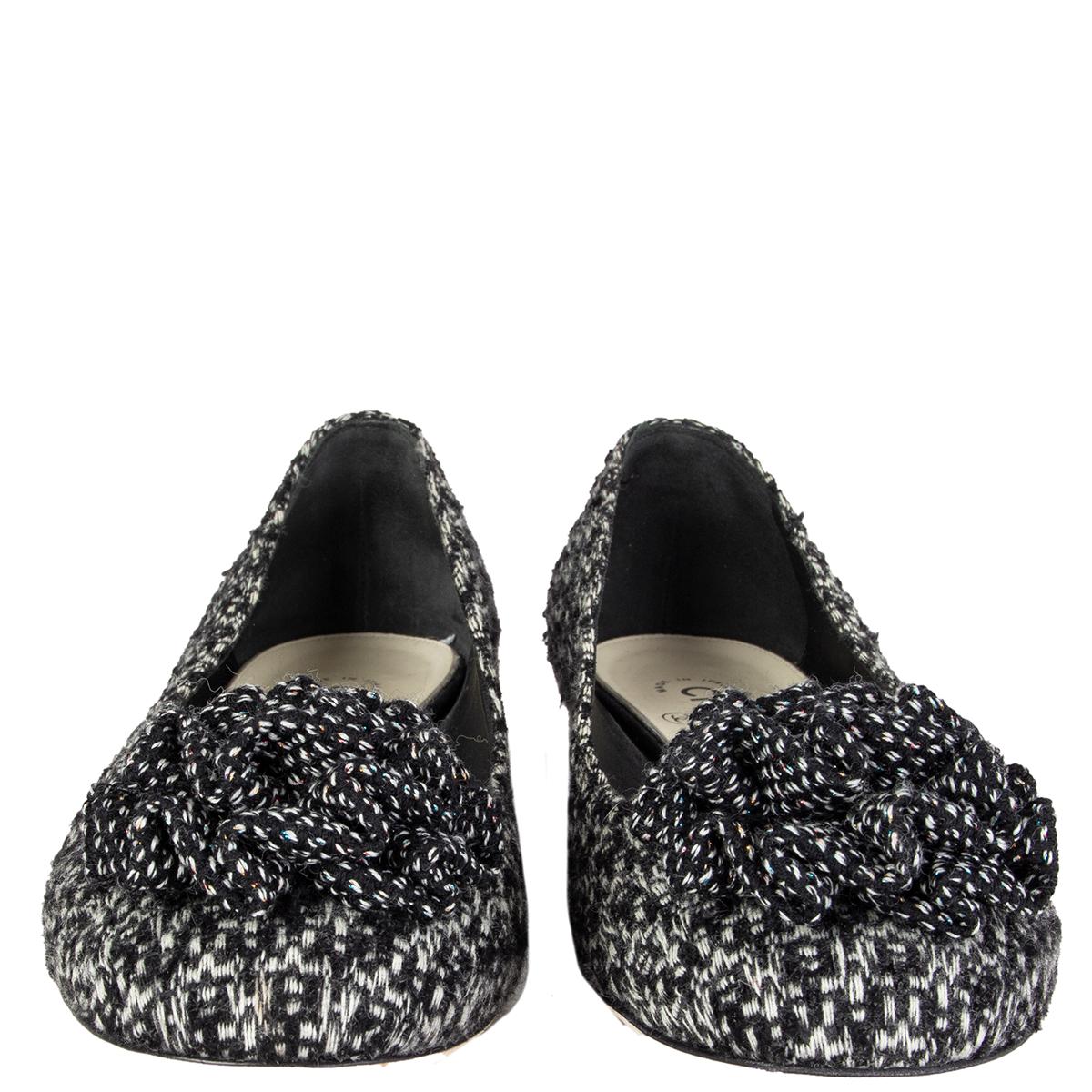 100% authentic Chanel block heel flats in black and off-white bouclé with blossom pom-pom on top. Have been worn once and are in virtually new condition. 

Measurements
Imprinted Size	40
Shoe Size	40
Inside Sole	26cm (10.1in)
Width	8cm