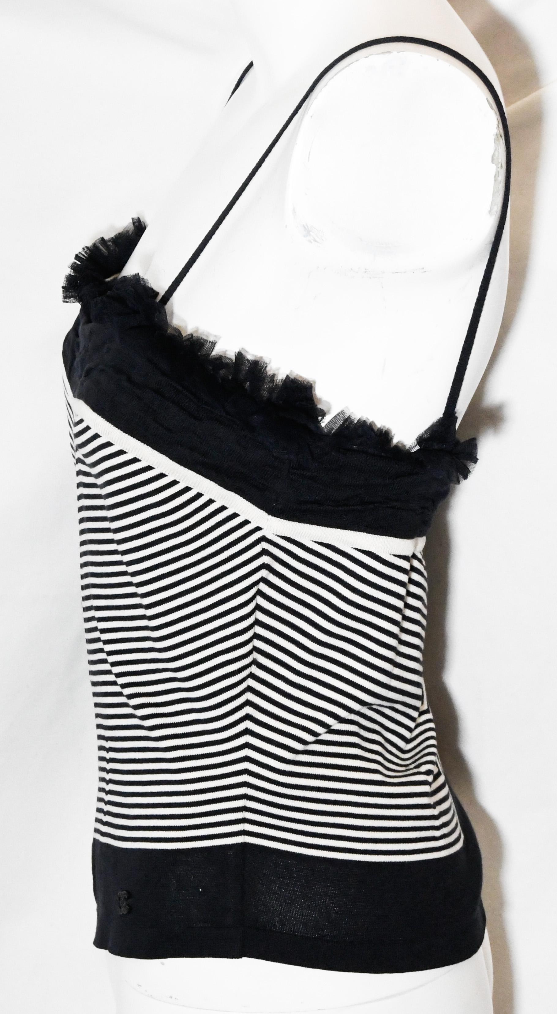 Chanel black and white camisole decorated with a black gathered tulle ruffles around the bustline.   This knit camisole's stripes came together at the front in a chevron design.  This camisole is casual and can be worn for day or night, with or