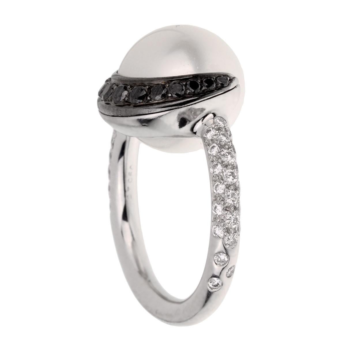 A fabulous Chanel diamond ring circa 2000s adorned with round brilliant cut diamonds, and round brilliant cut diamonds encasing the pearl set in platinum.

Resizeable