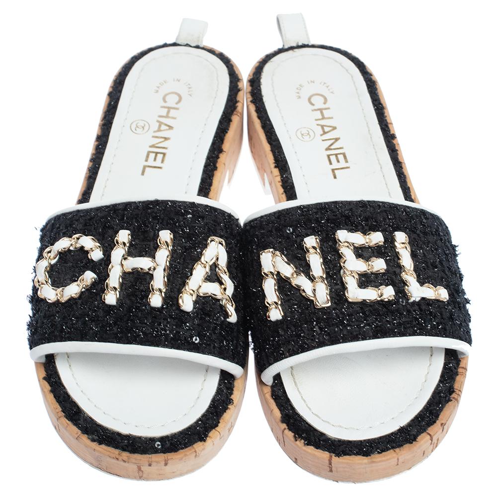 For days of ease and style, Chanel created these pretty slides. They have uppers covered in sequins and detailed with 'CHANEL', low heels and insoles lined with leather for comfort. The cork slides will come in handy with many of your outfits.