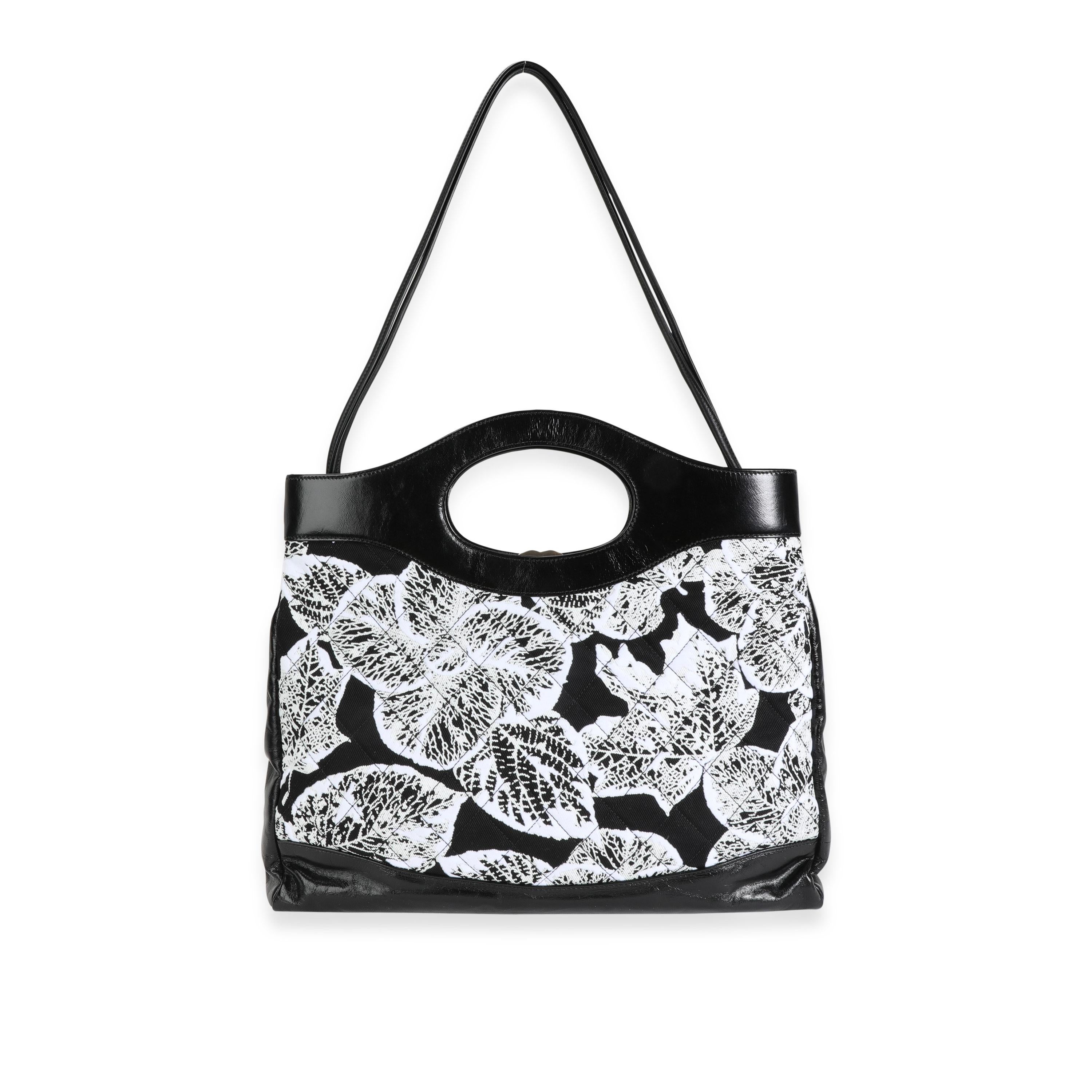 Listing Title: Chanel Black & White Floral Canvas and Calfskin Large 31 Bag
SKU: 118293
Condition: Pre-owned (3000)
Handbag Condition: Mint
Condition Comments: Mint Condition. Plastic on some hardware. No visible signs of wear. Final Sale.
Brand: