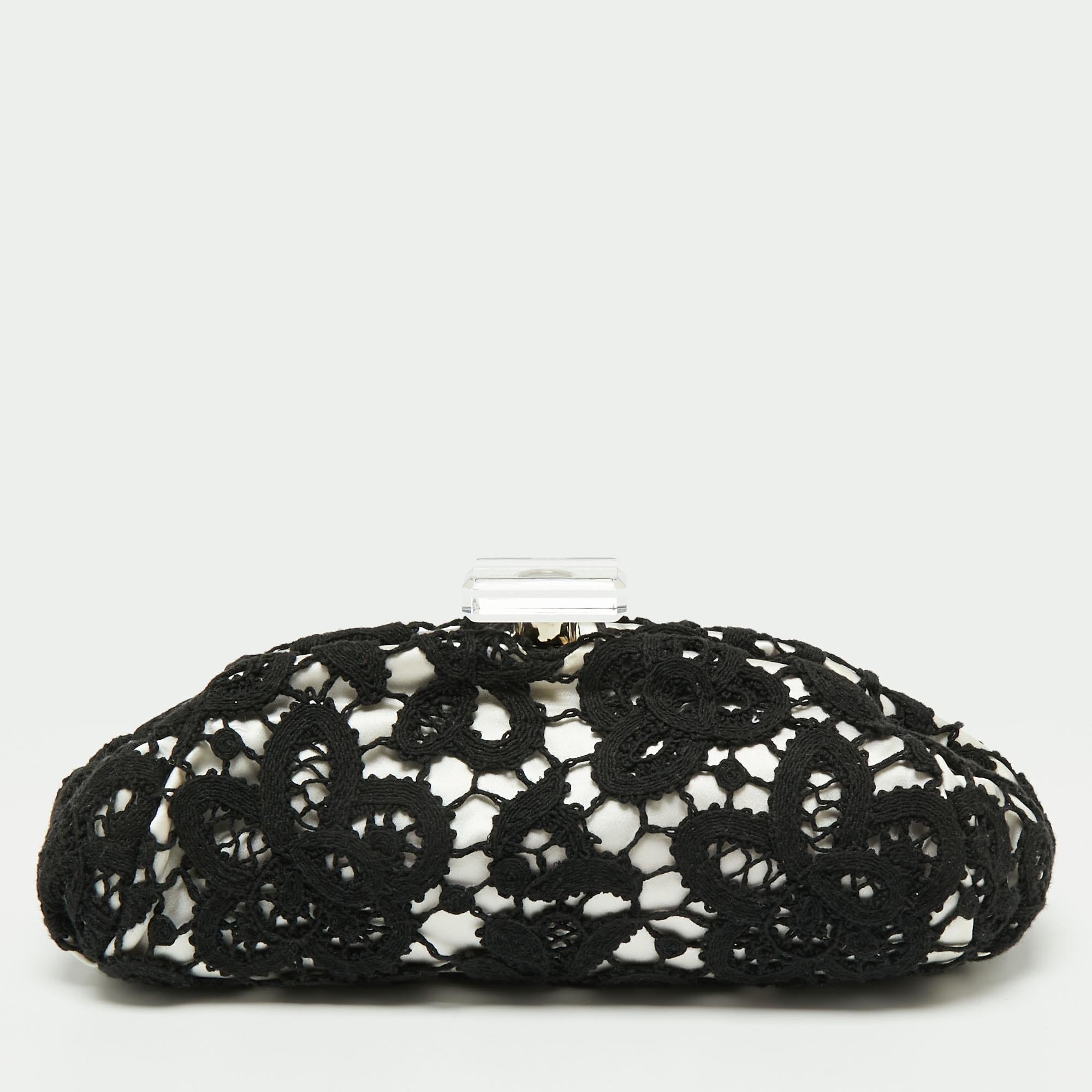 Chanel presents to you this lovely frame clutch for parties and special events! It is crafted from beautiful lace and flaunts a sleek shape with a frame-top. It is complete with a well-sized satin interior.

