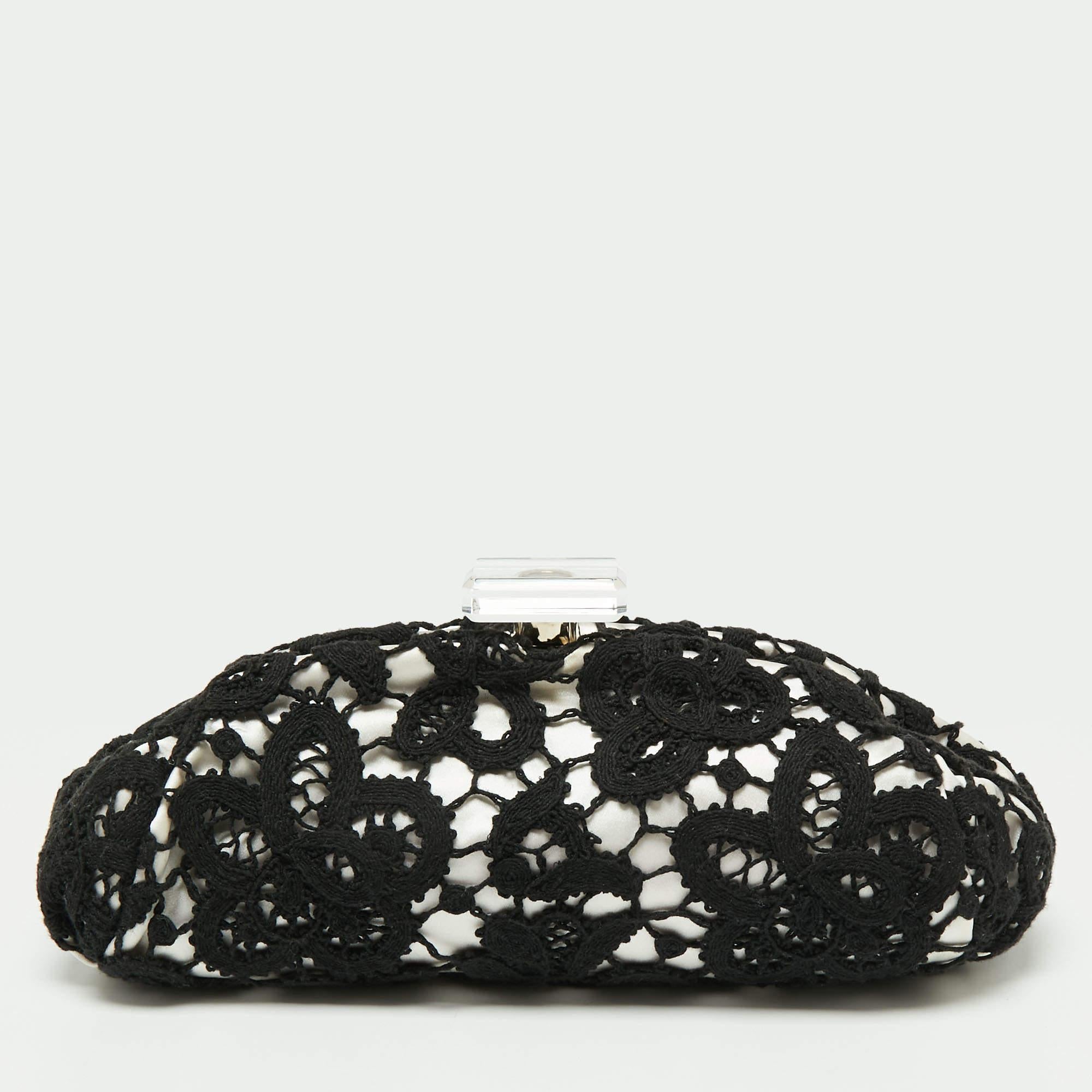 Chanel presents to you this lovely frame clutch for parties and special events! It is crafted from beautiful lace and flaunts a sleek shape with a frame-top. It is complete with a well-sized satin interior.

