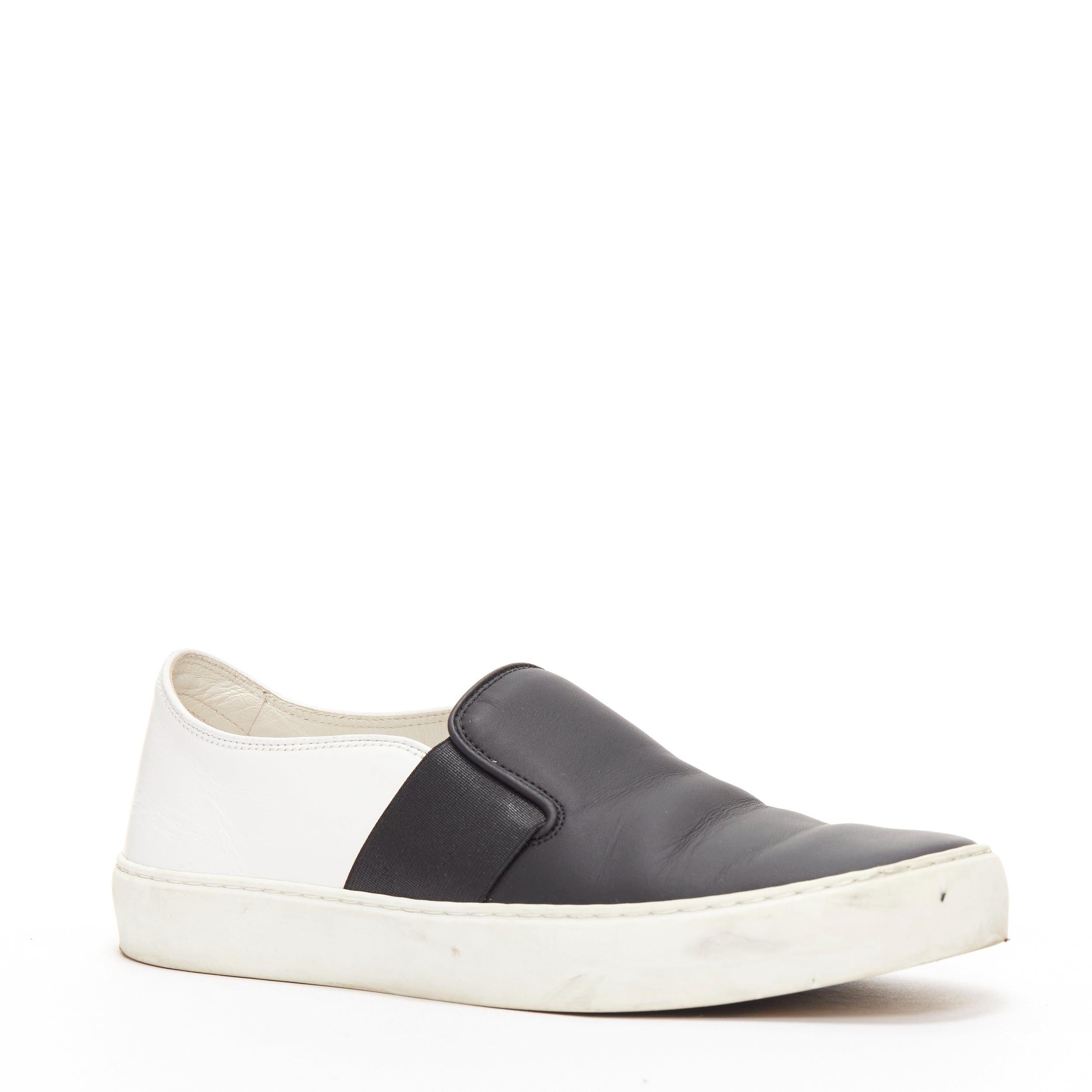 CHANEL black white leather CC logo back minimal classic skates sneakers EU36
Reference: YIKK/A00154
Brand: Chanel
Material: Leather
Color: Black, White
Pattern: Solid
Closure: Slip On
Lining: White Leather
Extra Details: CC logo back.
Made in: