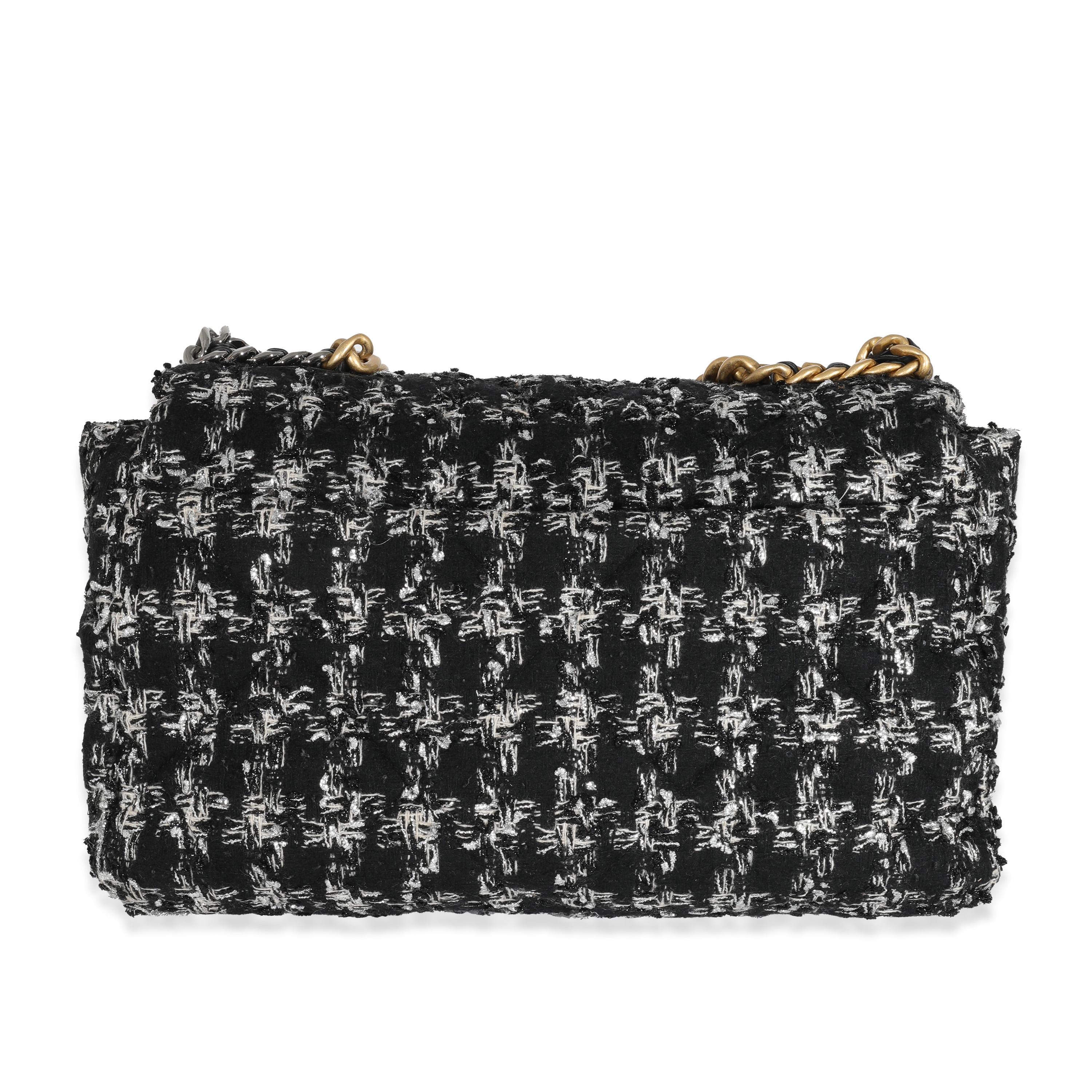 Listing Title: Chanel Black White Metallic Houndstooth Tweed Chanel 19 Maxi Flap Bag
SKU: 131735
Condition: Pre-owned 
Condition Description: A timeless classic that never goes out of style, the flap bag from Chanel dates back to 1955 and has seen a