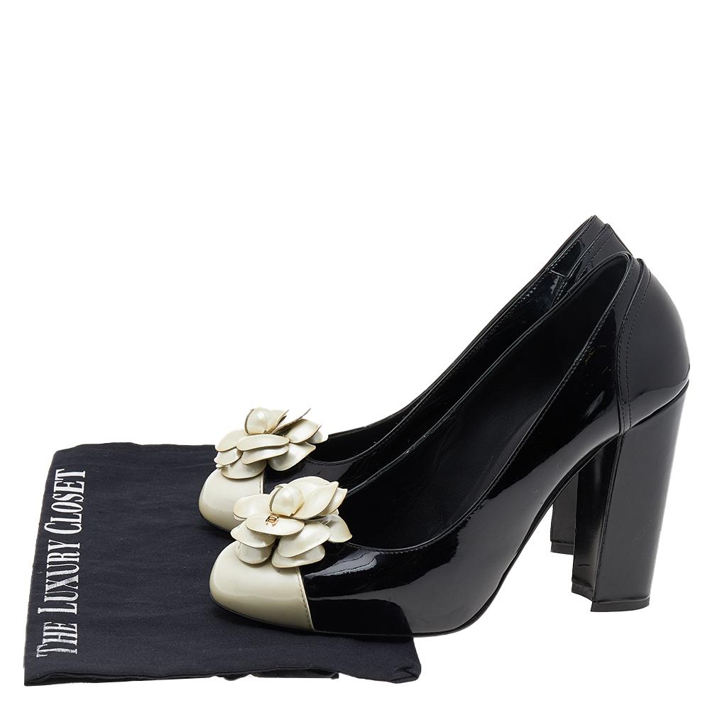 Create an aura of elegance with these stunning Chanel pumps for women. These pumps are crafted from patent leather in a black shade. The pair flaunts the signature Camellia detailing on the uppers, leather-lined insoles, white round toes, and block