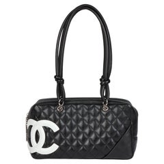 CHANEL Schwarz-Weißes gestepptes Lammfell Großer Bowler-Kabinett