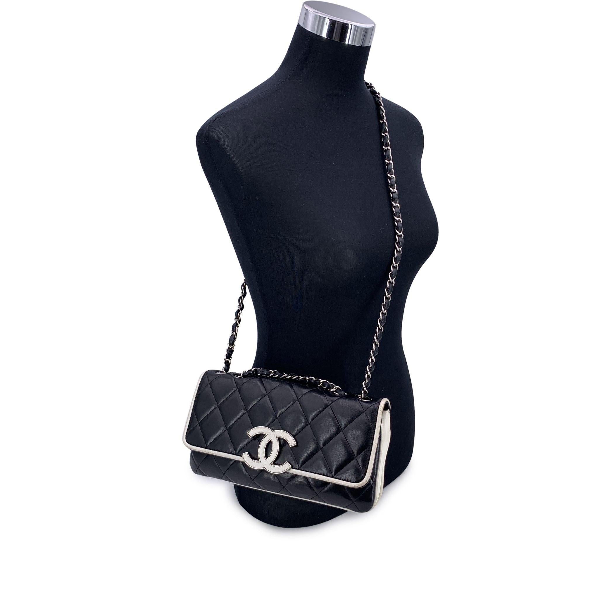 This beautiful Bag will come with a Certificate of Authenticity provided by Entrupy. The certificate will be provided at no further cost This Chanel Black and White Quilted Leather Divine Medium Flap Bag is a breathtaking piece from the iconic