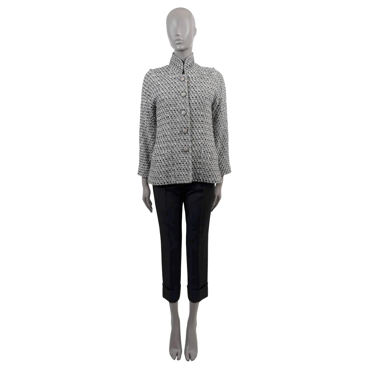 100% authentic Chanel lurex tweed jacket in black, cream, grey and silver wool (39%), viscose (27%), nylon (20%) and acrylic (14%). Features a stand-up collar, as well a second almost off the shoulder neckline, raglan sleeves and two open pockets at
